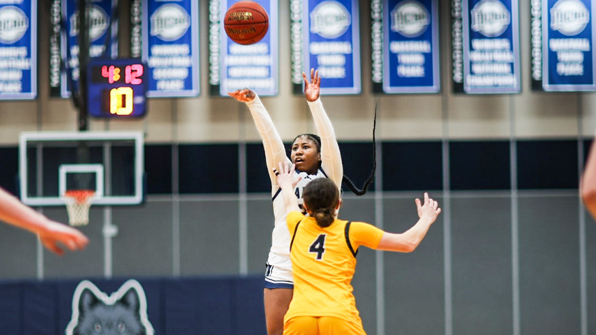 Serinity Metcalfe shoots a 3-pointer over a defender