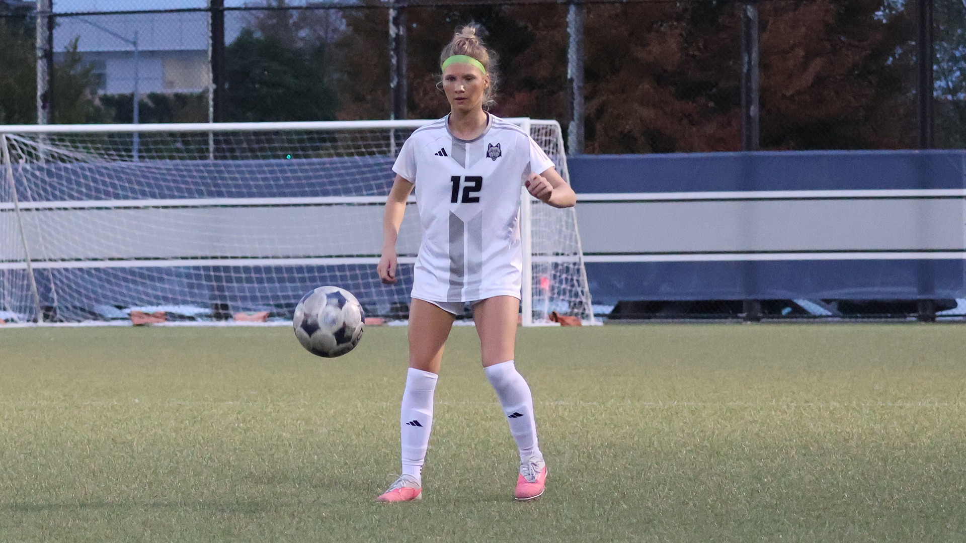 Emma Koziel reacts as a ball bounces towards her