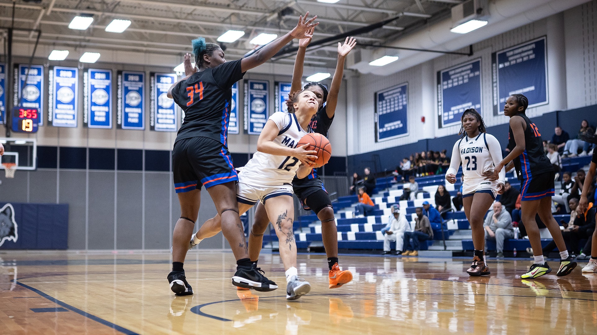 Chloey Bynum dribbles through two defenders