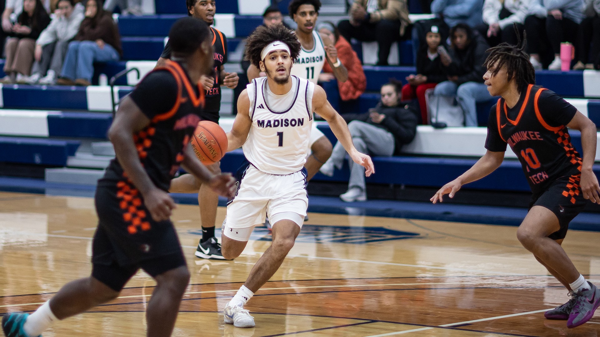 Jevon Campbell drives against defenders