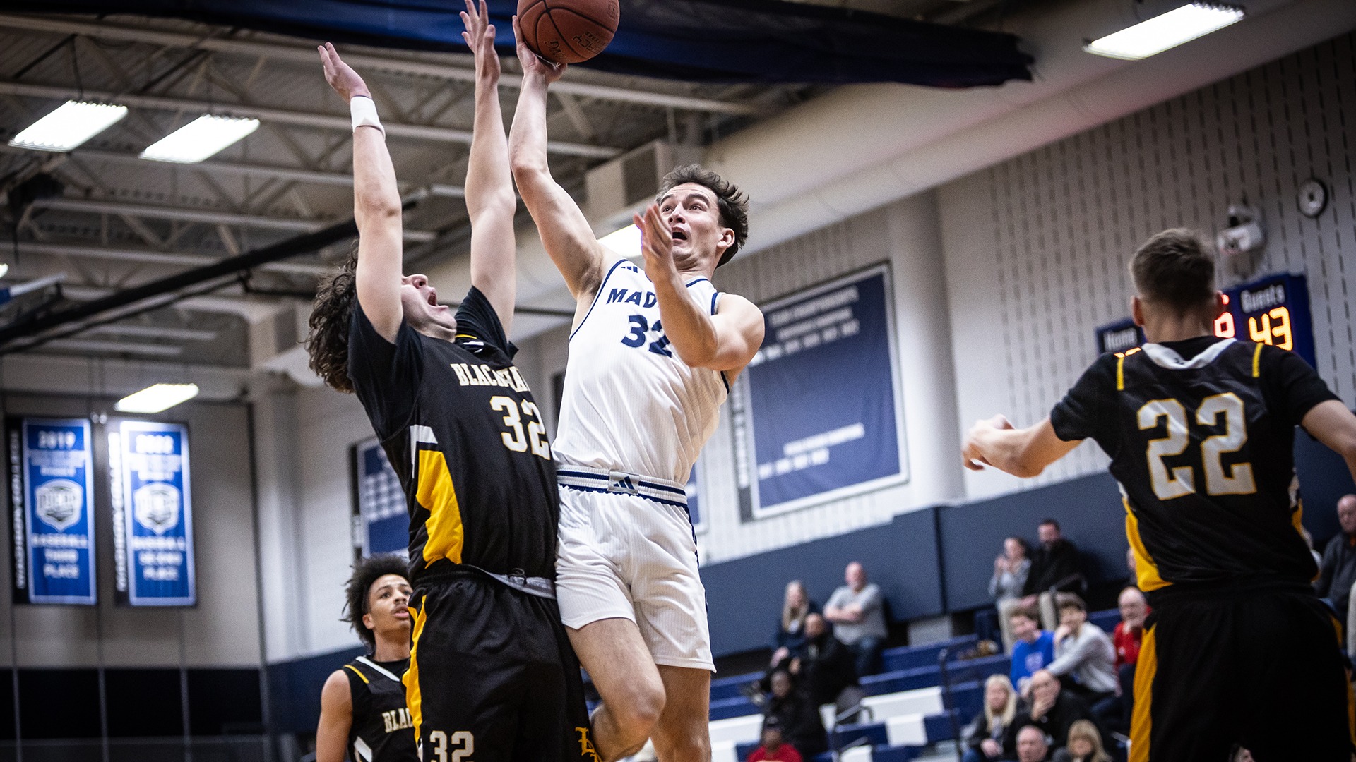 Jacob Ulrich goes up for a shot against a defender