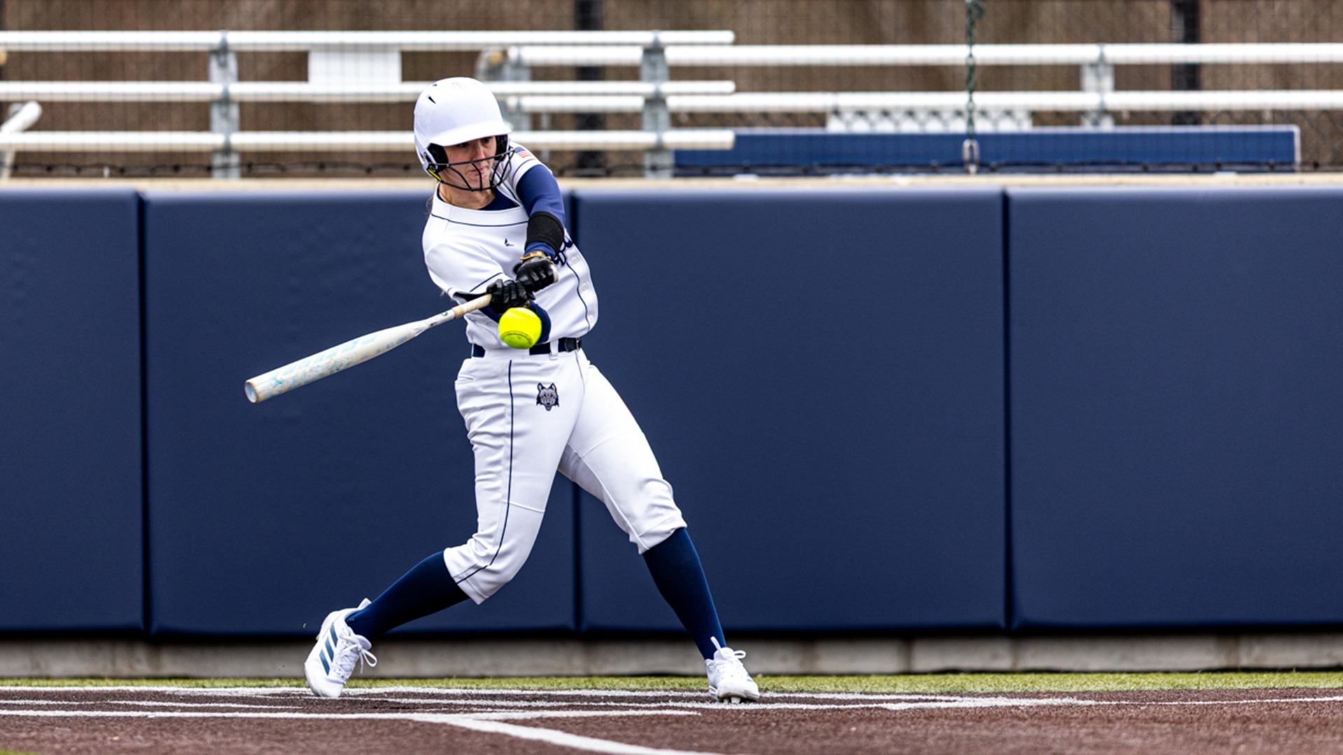 Raegen Schwarz swings her bat towards an oncoming pitch