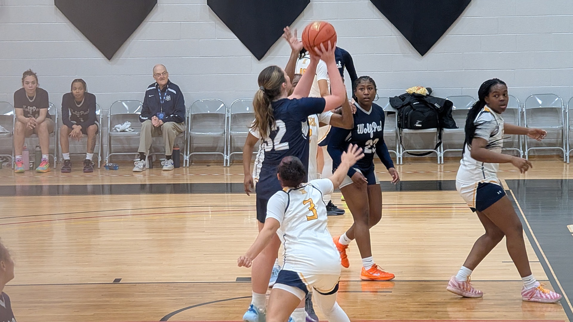 Maddie DeSmet goes up for a shot against a defender