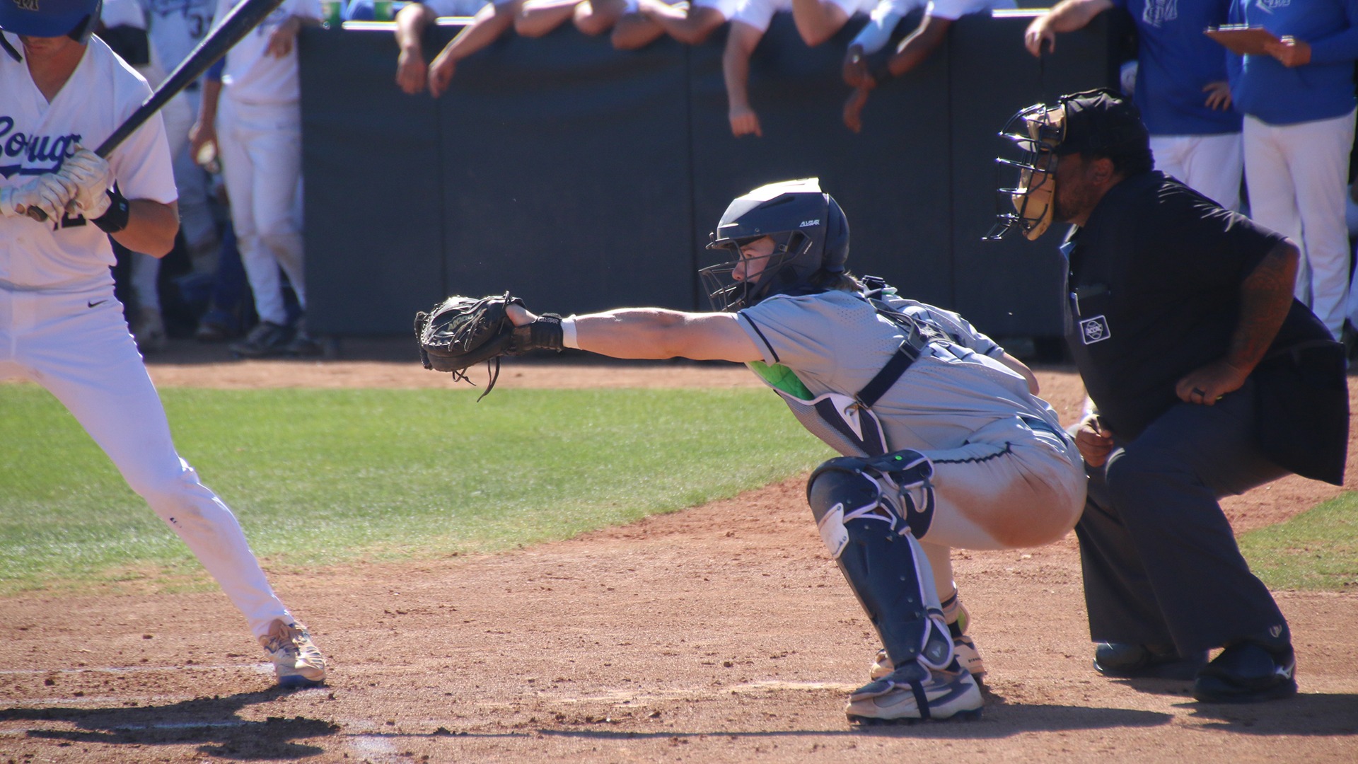 Nate Novinska catches a pitch behind home plate