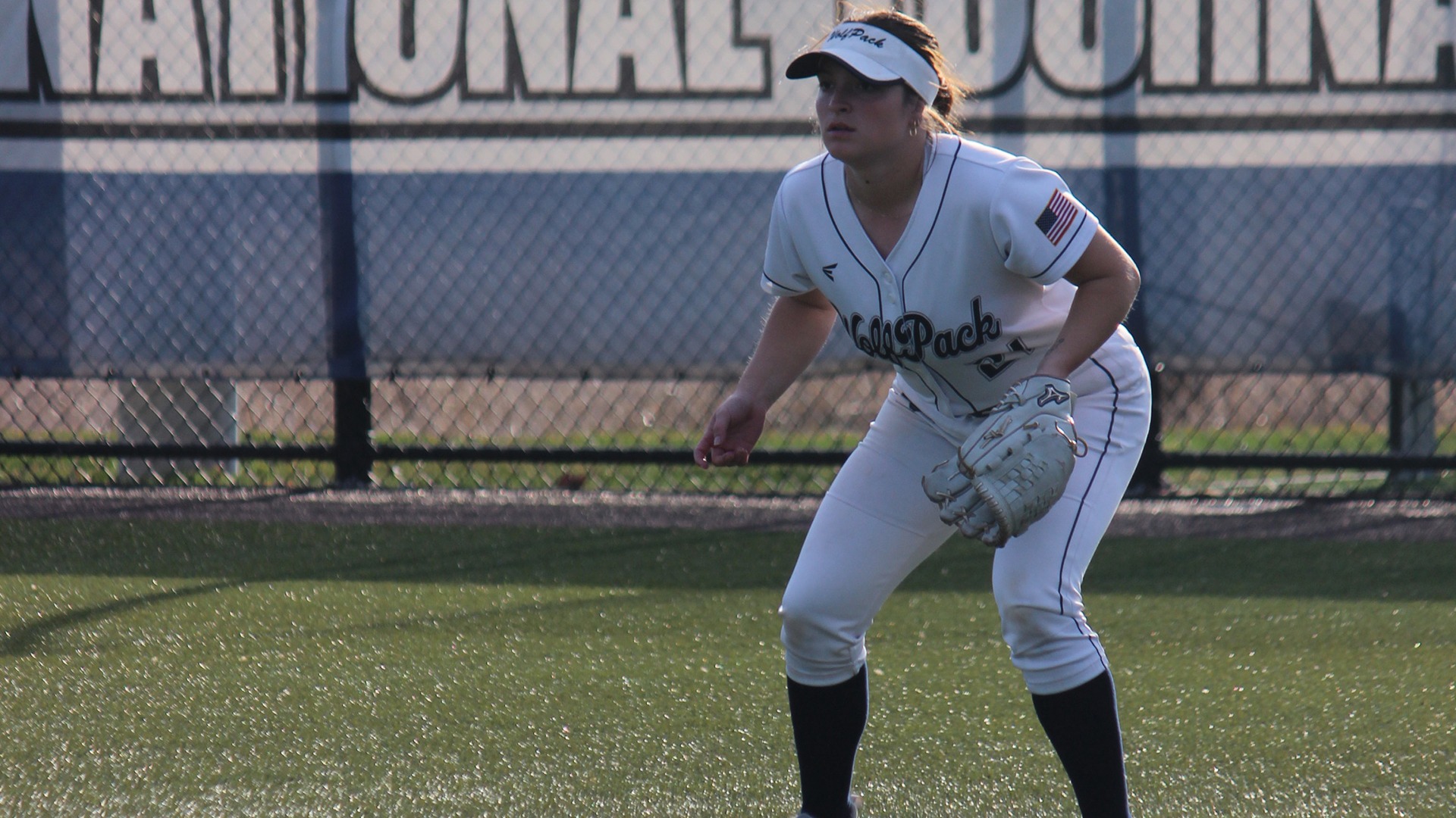 Bailey Mester stands ready with her glove in the outfield.