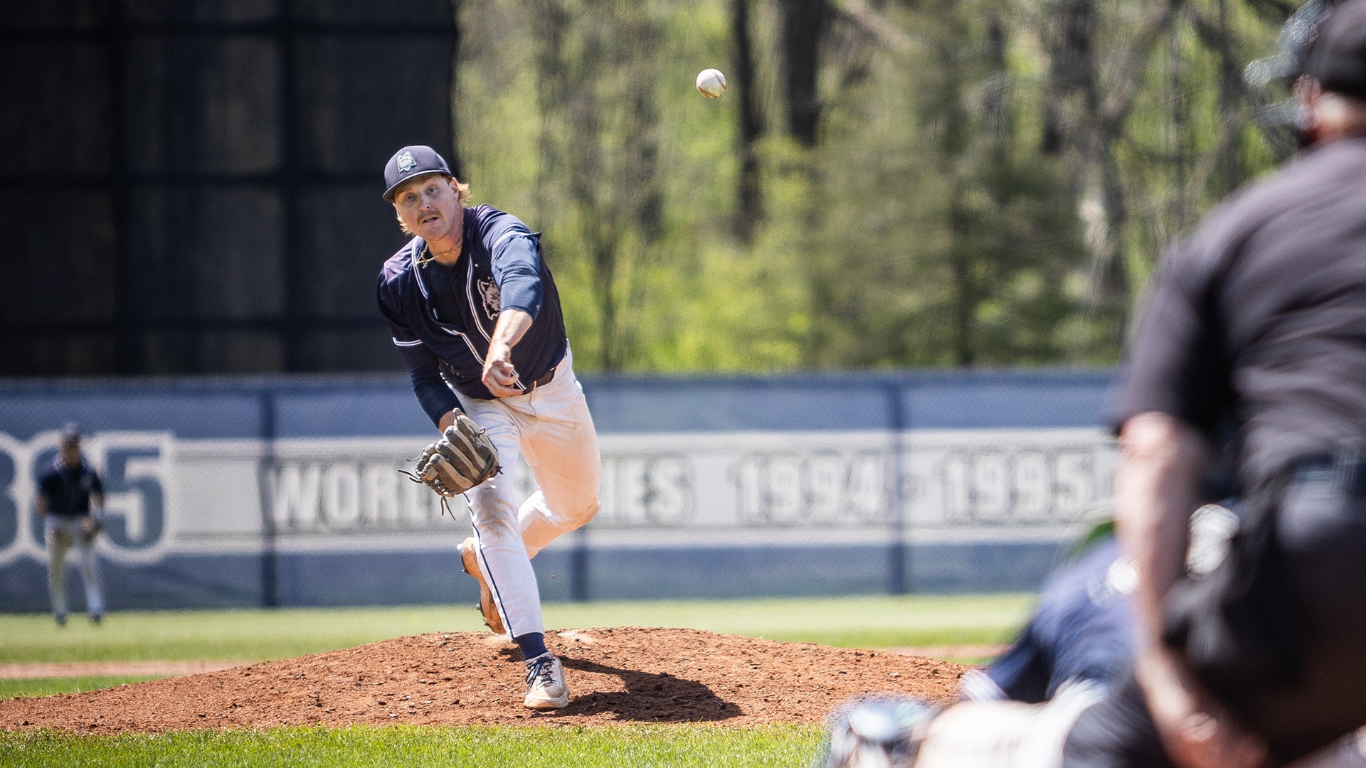 Noah Marschke throws a pitch towards the waiting catching, batter, and umpire.