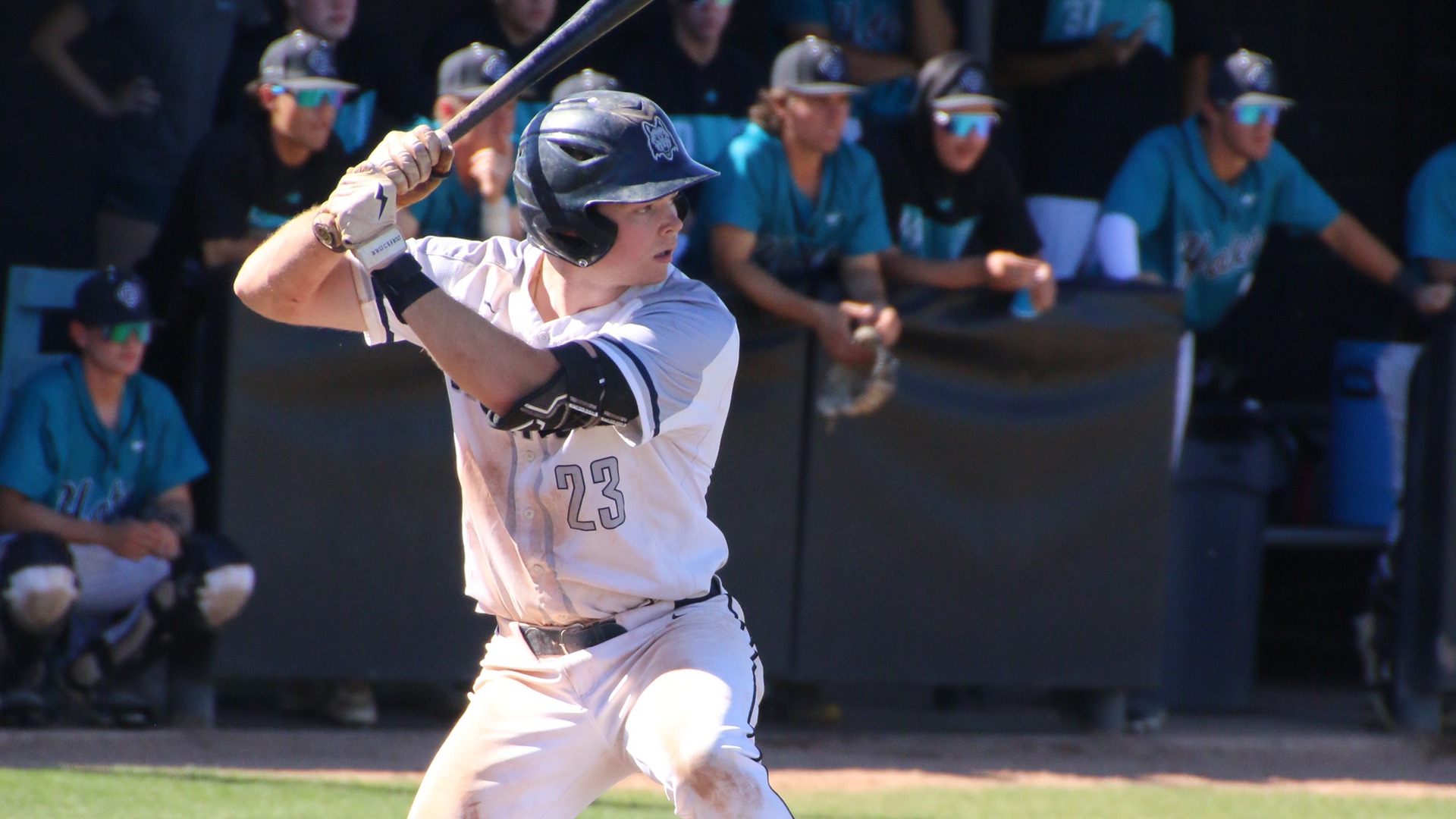 Beau Bloxdorf prepares to hit as the opposing team looks on in the background.