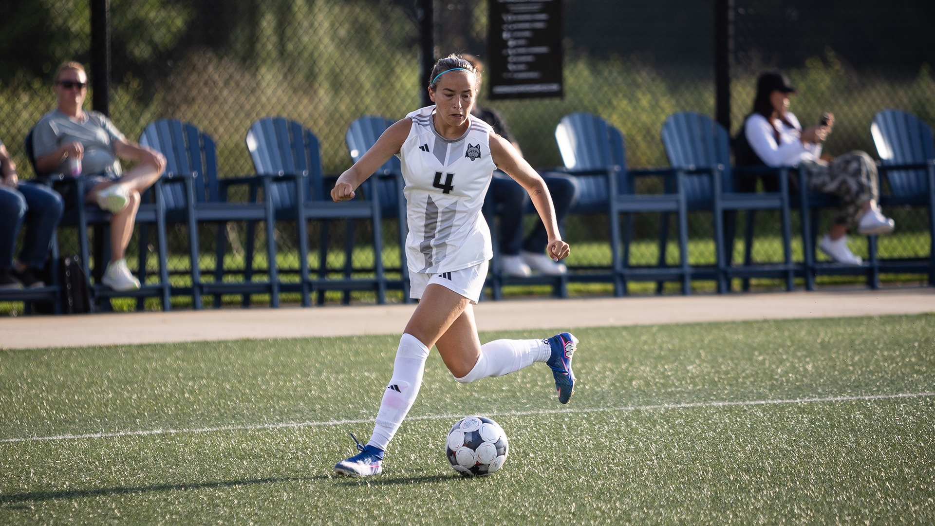 Maddie Ludwig dribbles the ball up the sideline