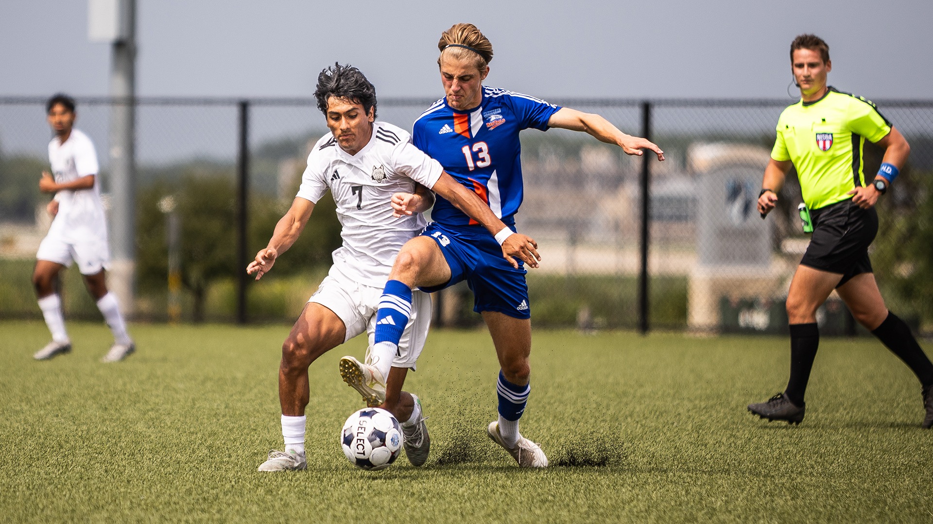 Gio Diaz battles an opposing player for possession of the ball