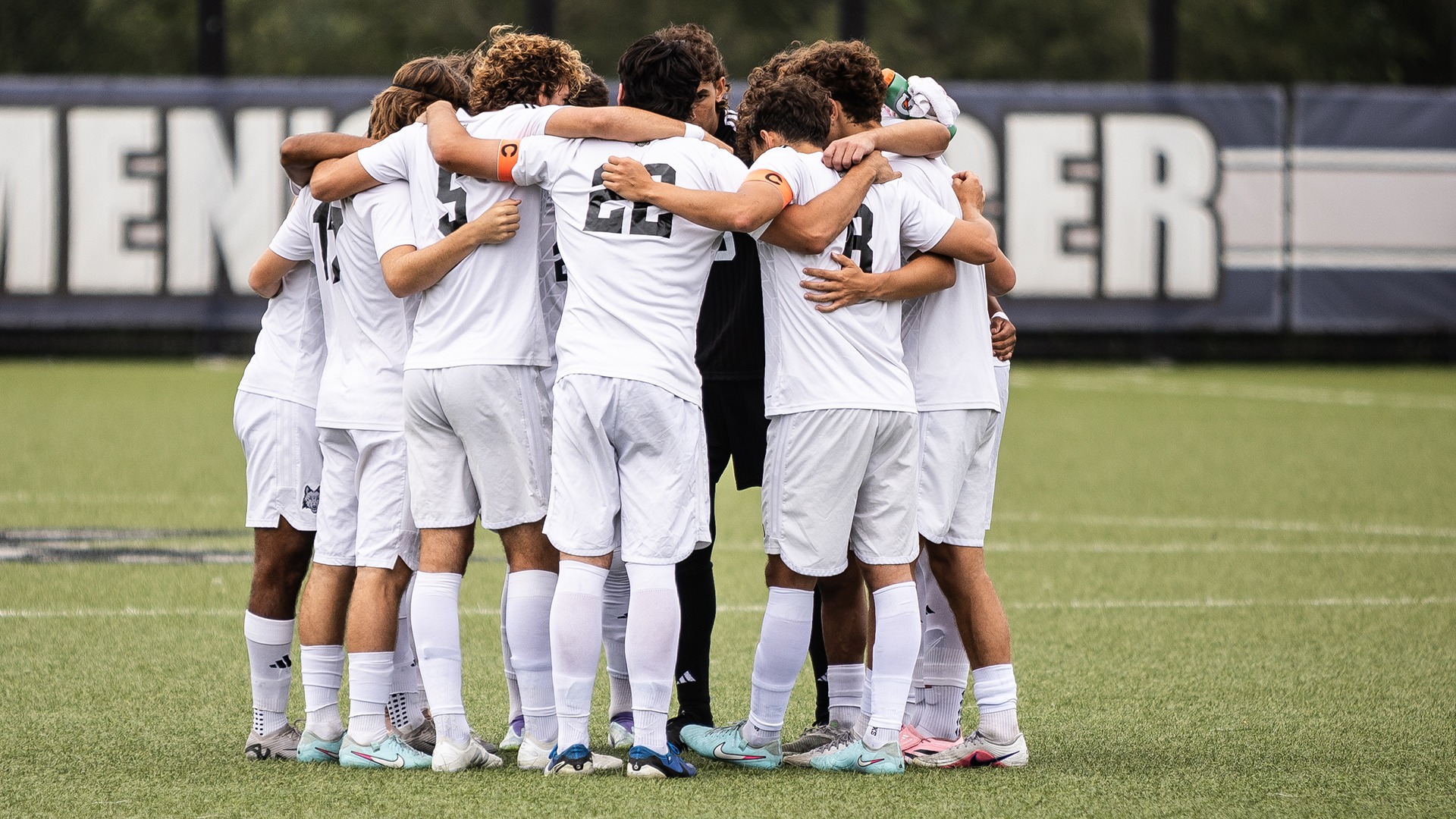 Men's Soccer team huddles before a home match