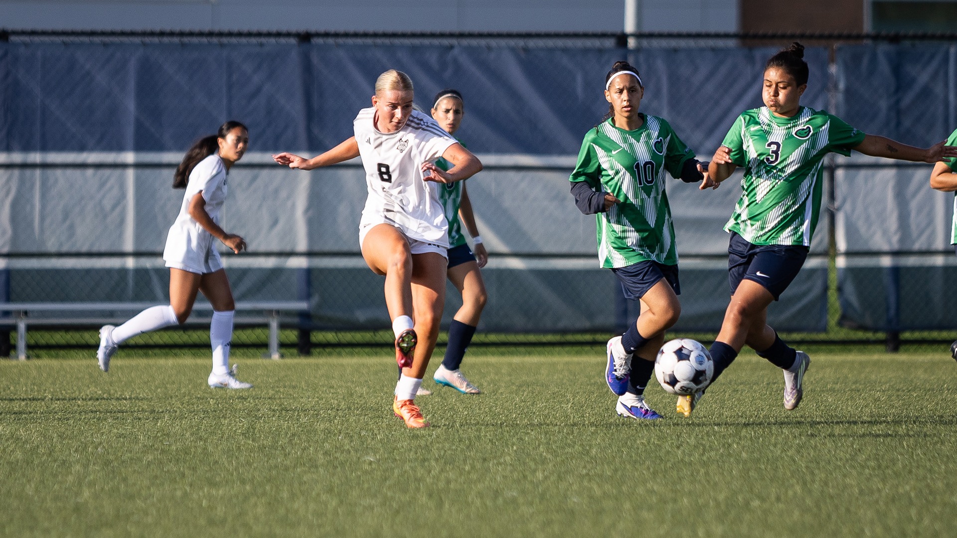 Amalia Molgard sends a pass past three on-coming defenders