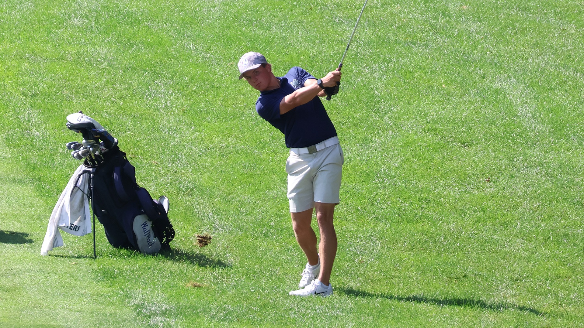 Kaden Zinkle follows through on a shot from the fairway