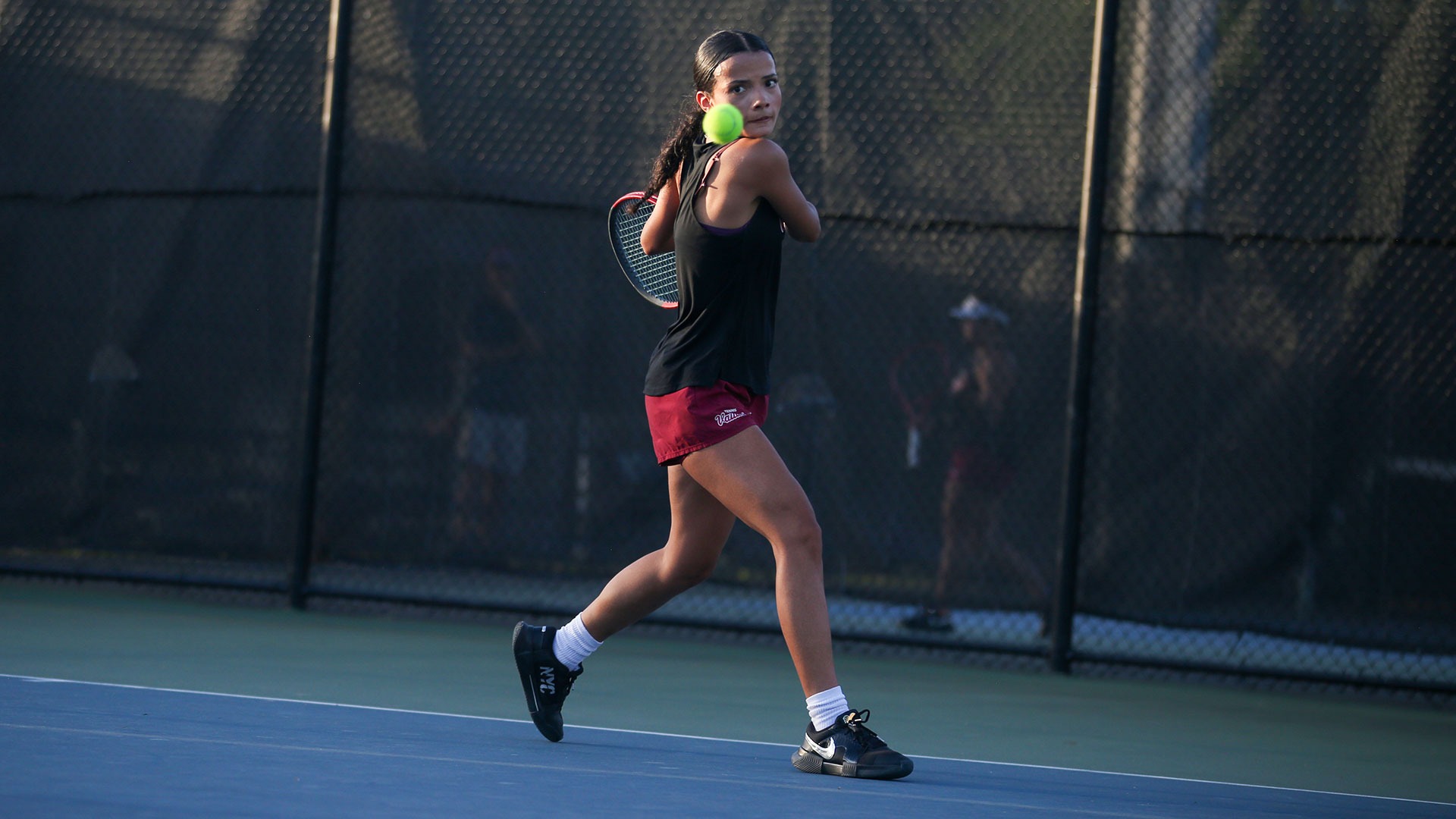 Addison Ortiz readies to return a shot against Sarah Lawrence