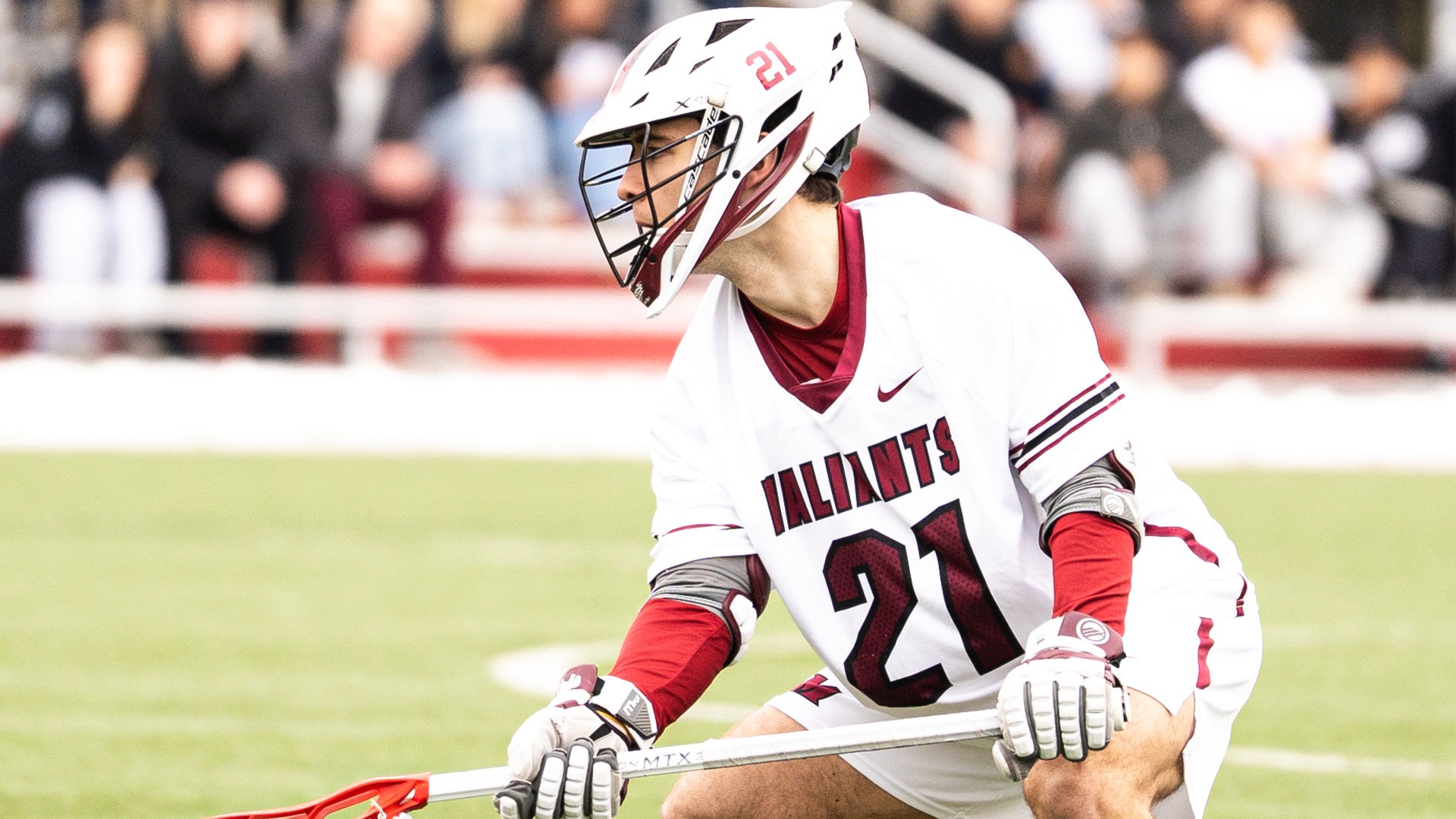 Jake Strobel crouches against Massachusetts Maritime