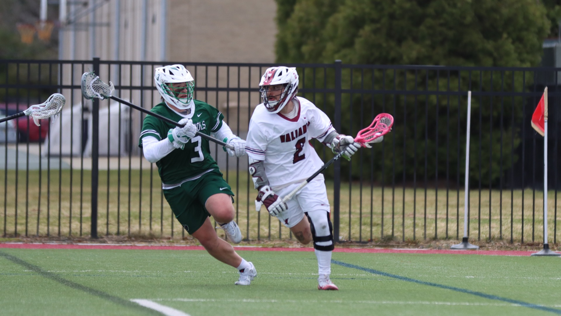 Frank Tallerico holds off a Nichols defender
