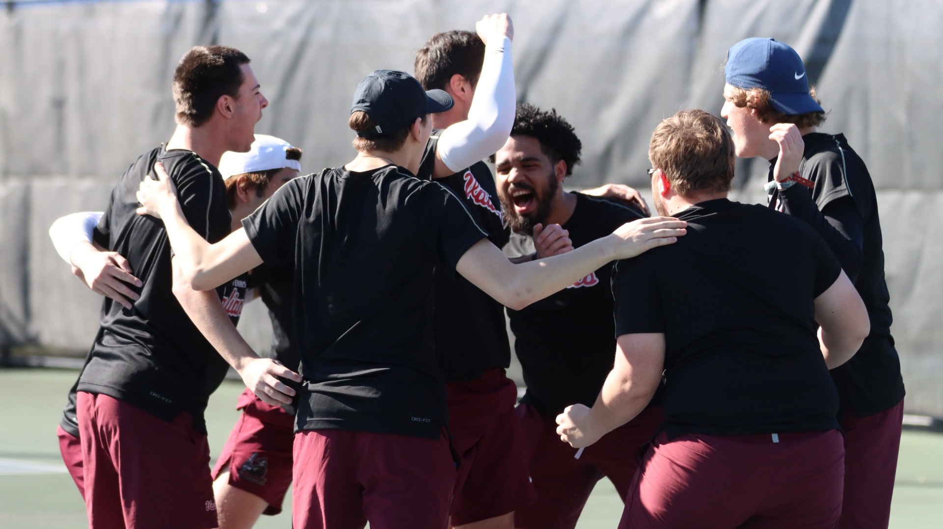 Men's Tennis celebrates with a pregame huddle