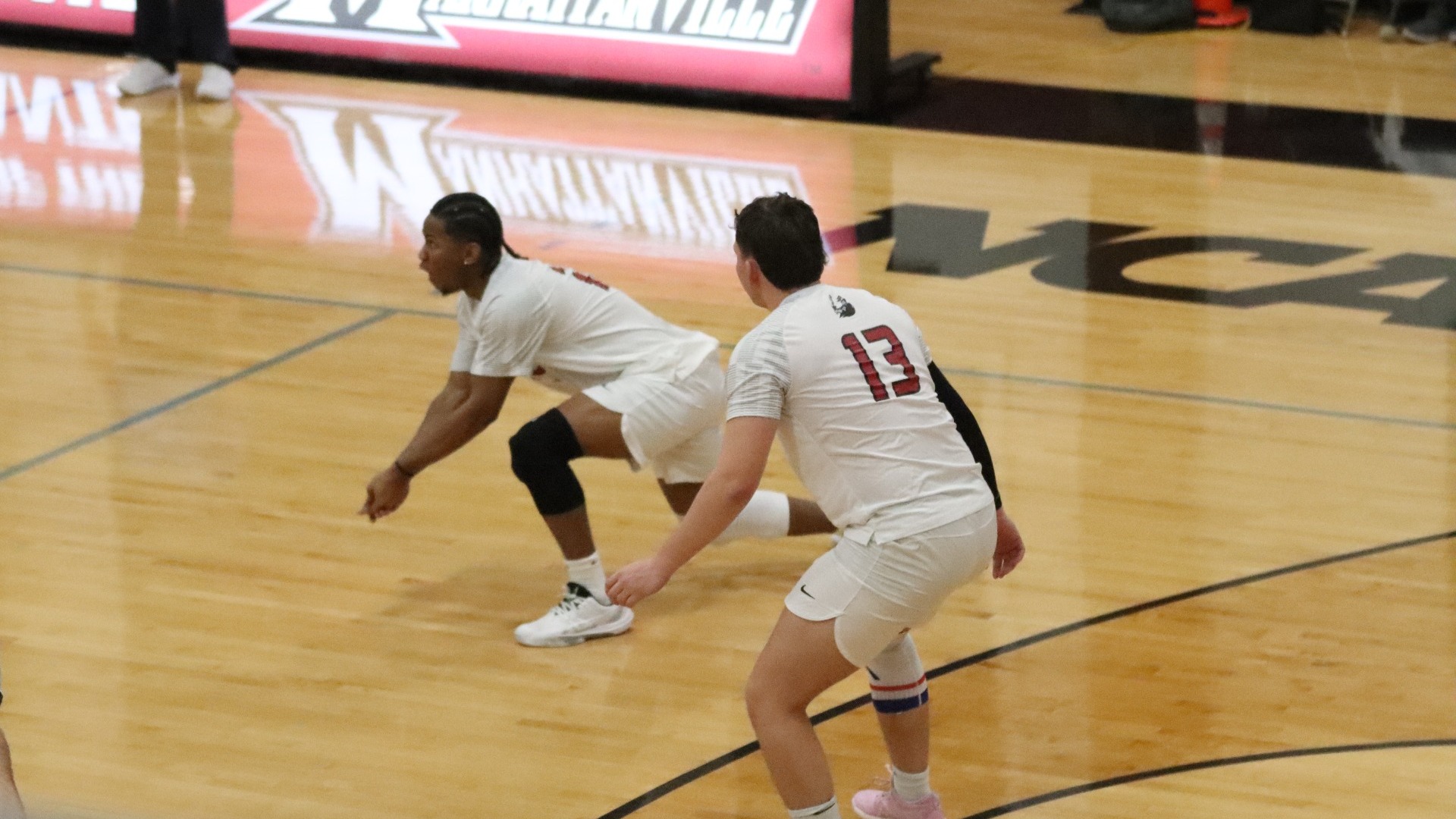 kyle simmons about to receive a ball; Joe Gandarillas ready for next play