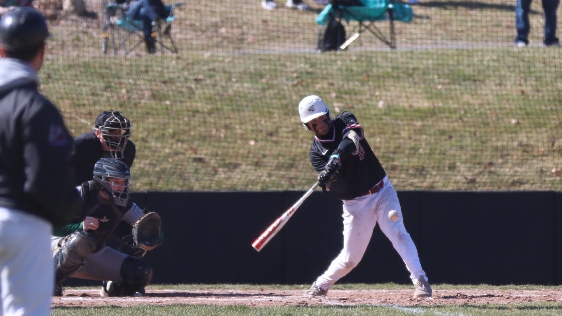 clara swing through, making impact with the ball