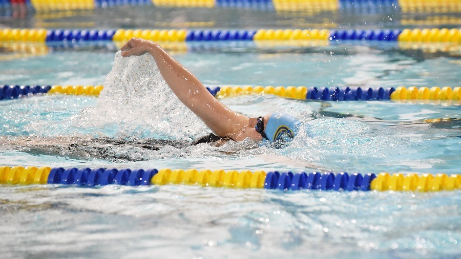 Claire MacDonald swimming the backstroke or medley