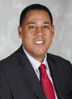 Headshot image of men's basketball coach Chuck Martin