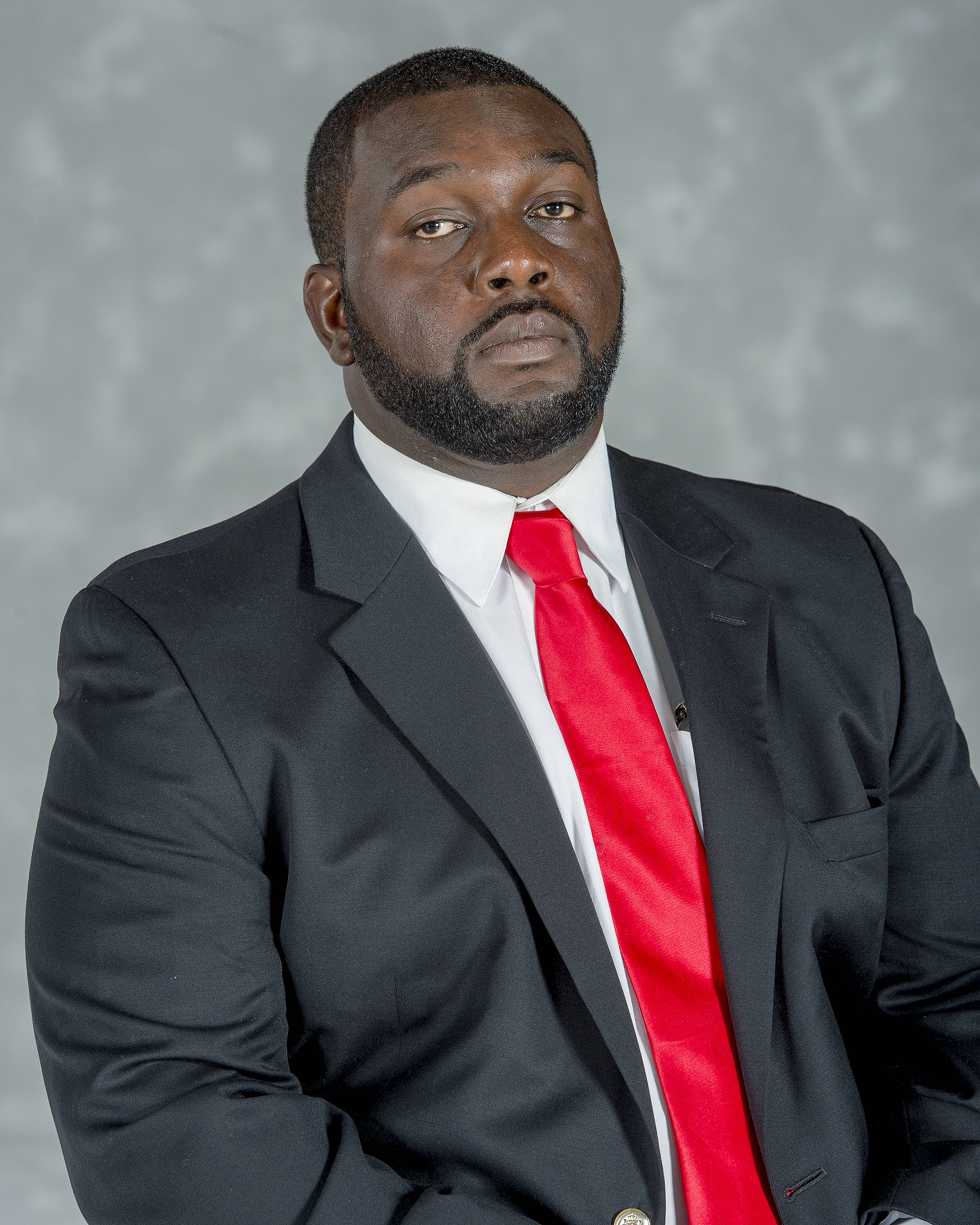 Headshot image of football coach Bemi Otulaja
