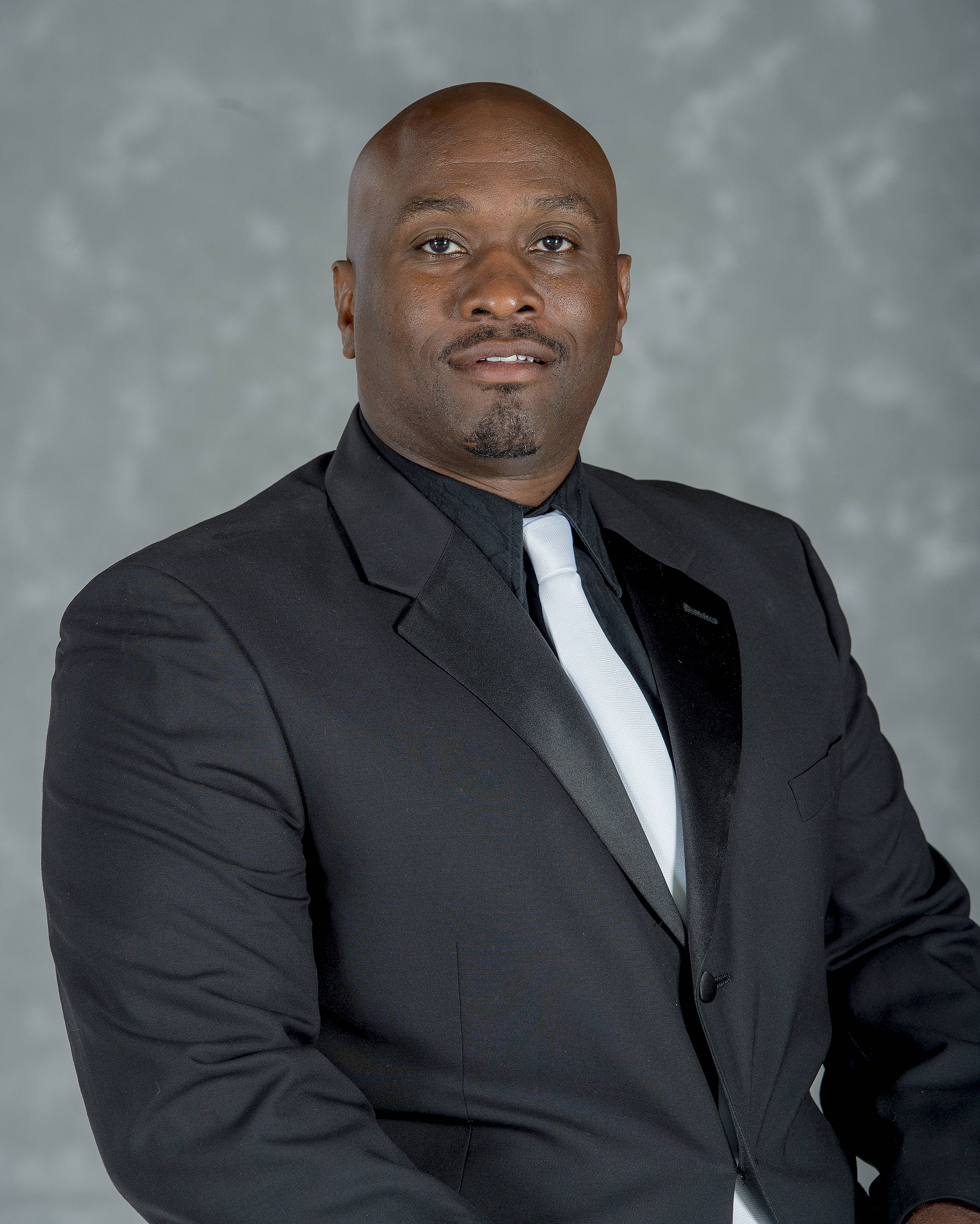 Headshot image of football coach Clarence Johnson