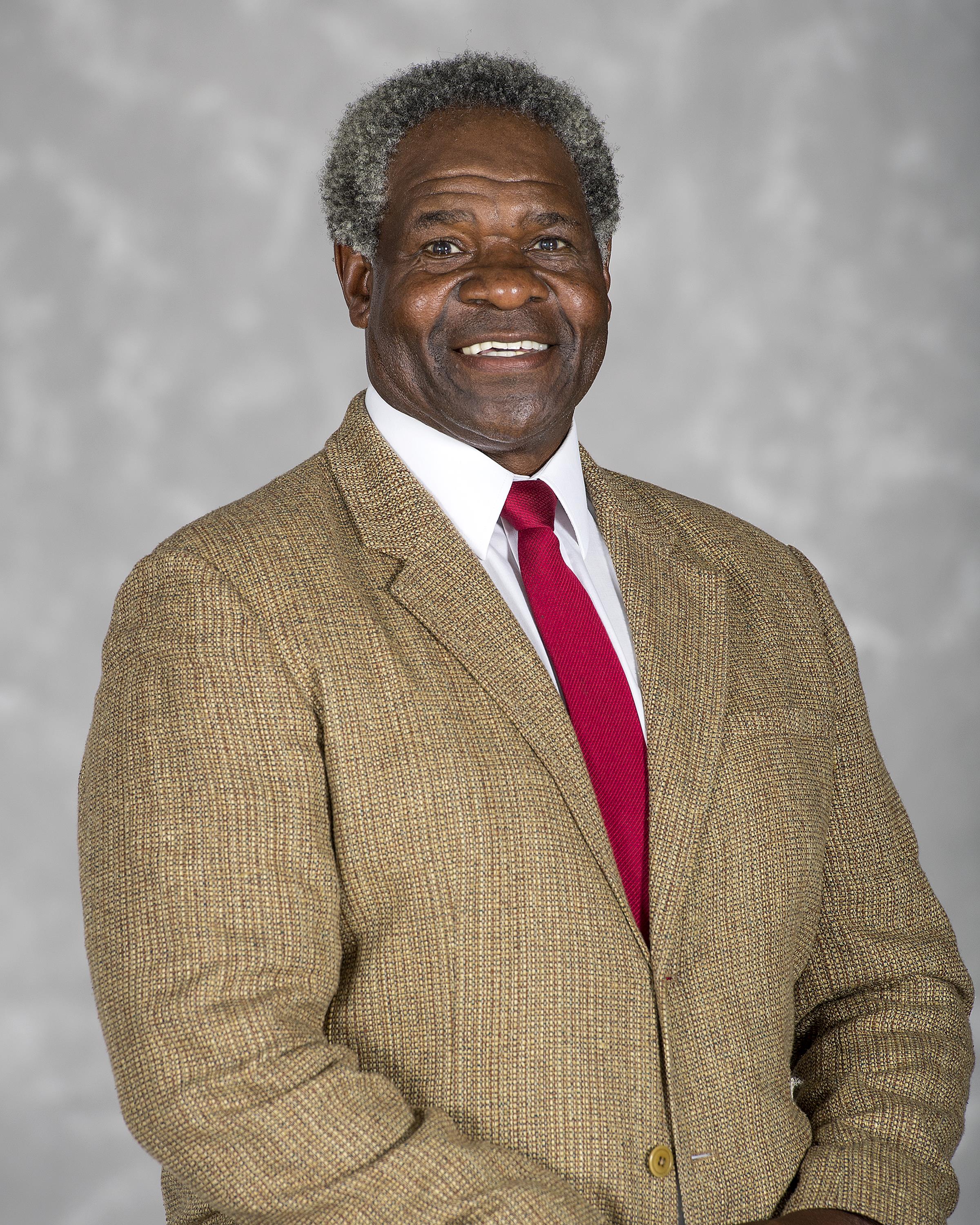 Head shot image of football assistant coach Larry Riley