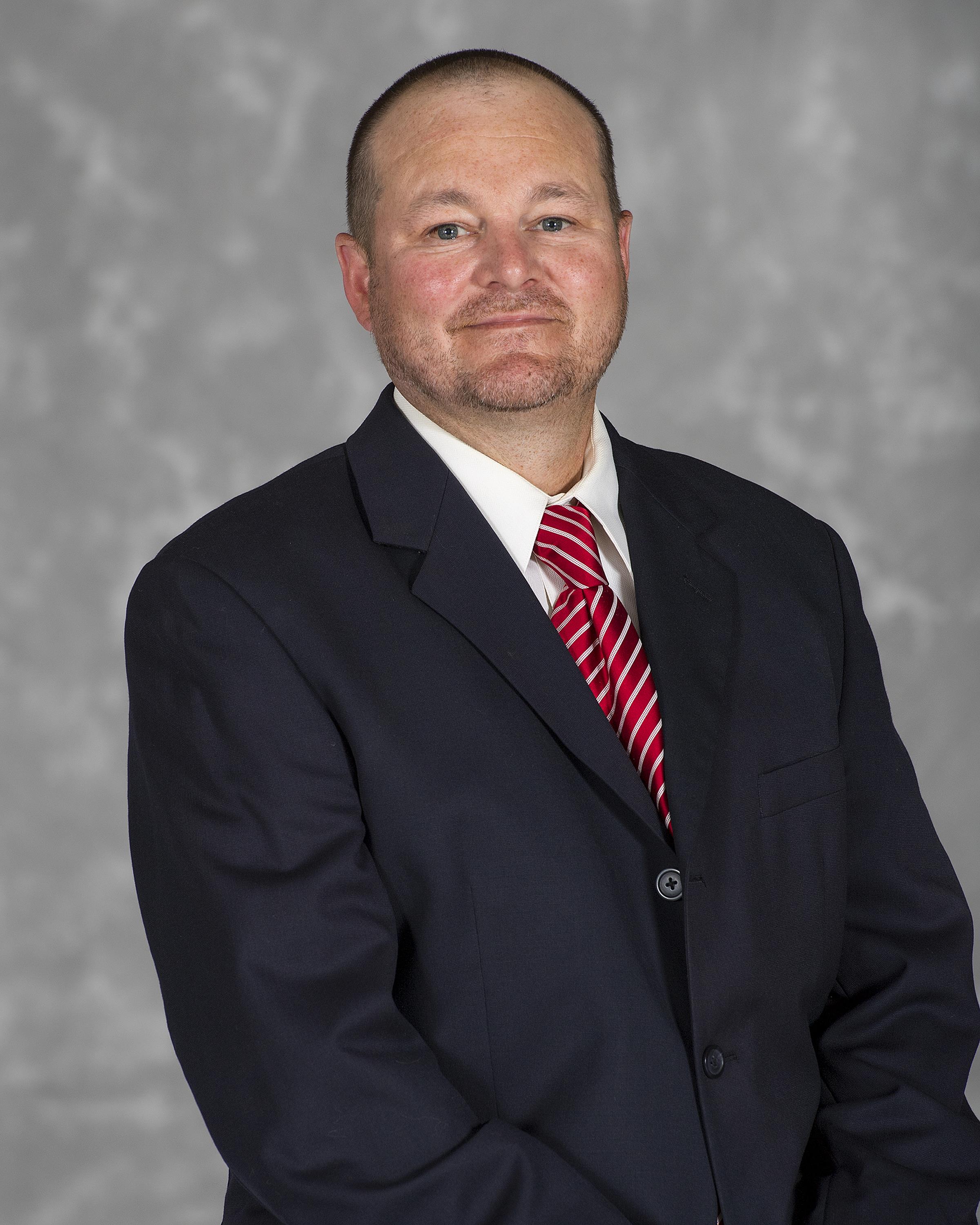 Head shot image of football assistant coach Marc Bourque