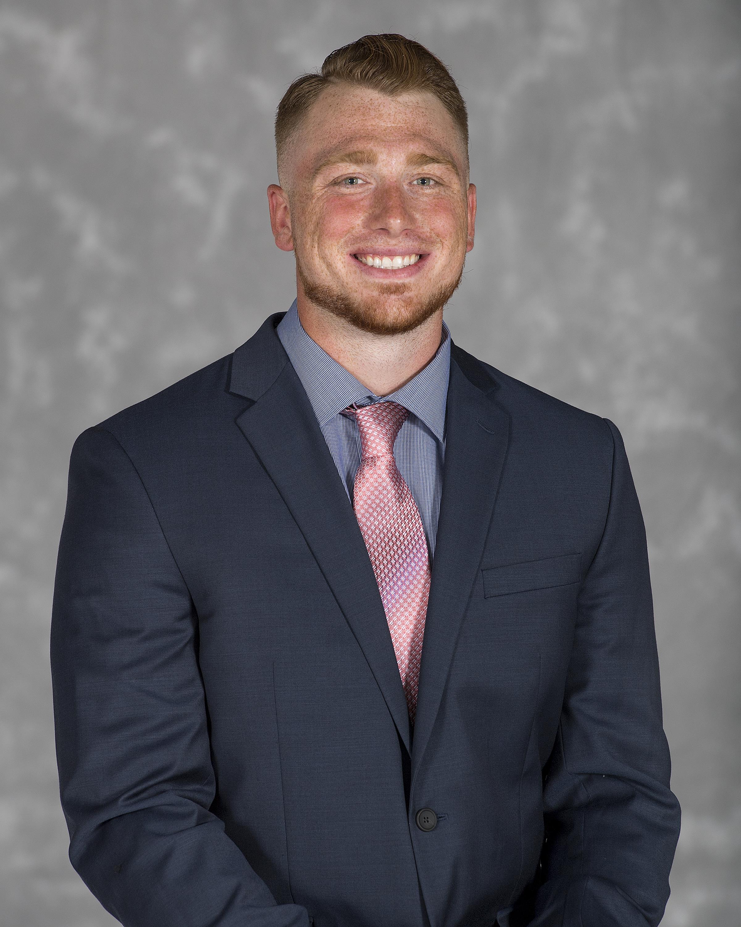 Head shot image of football assistant coach Matthew Poveromo