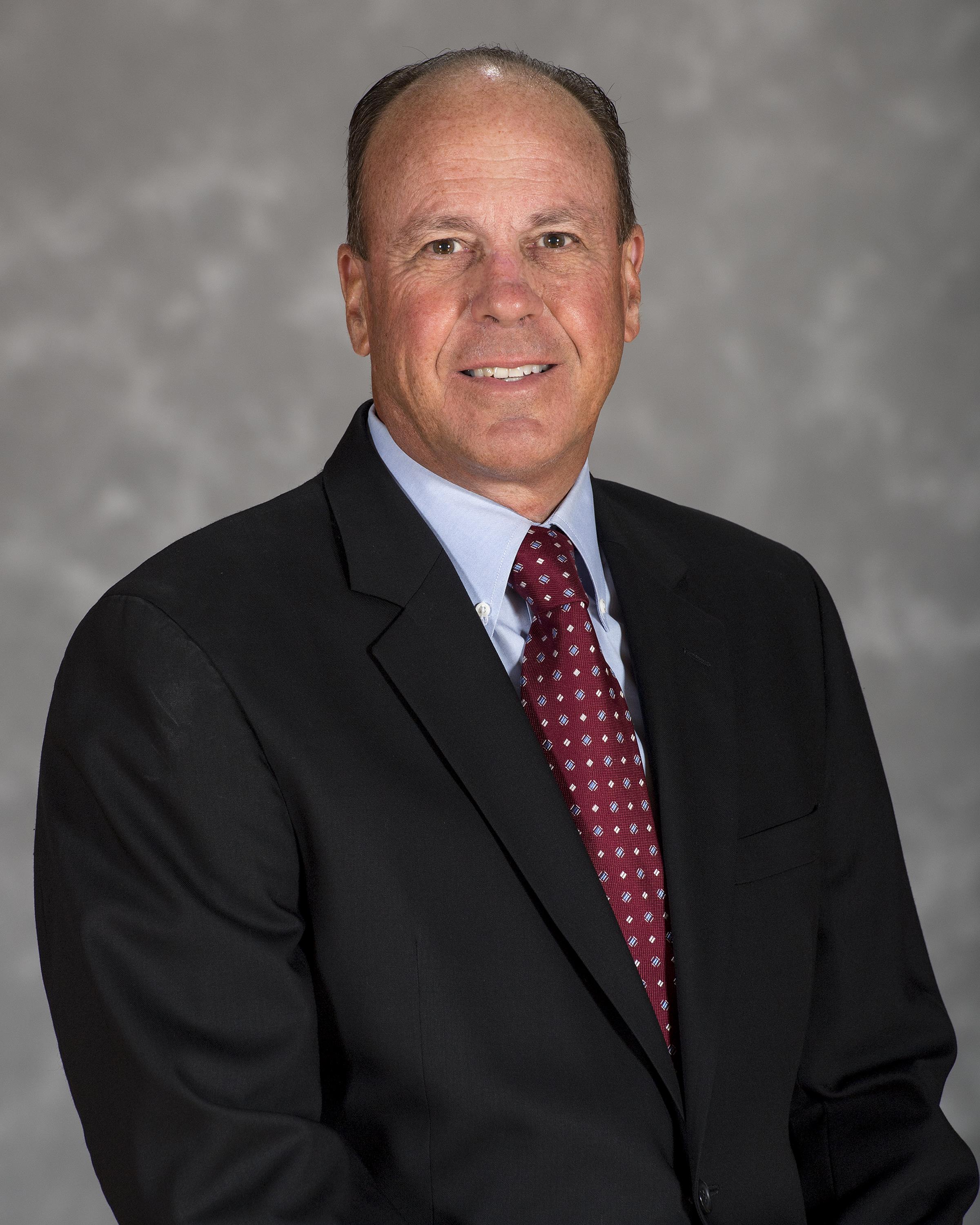 Headshot image of men's and women's swimming & diving head coach Larry VanWagner
