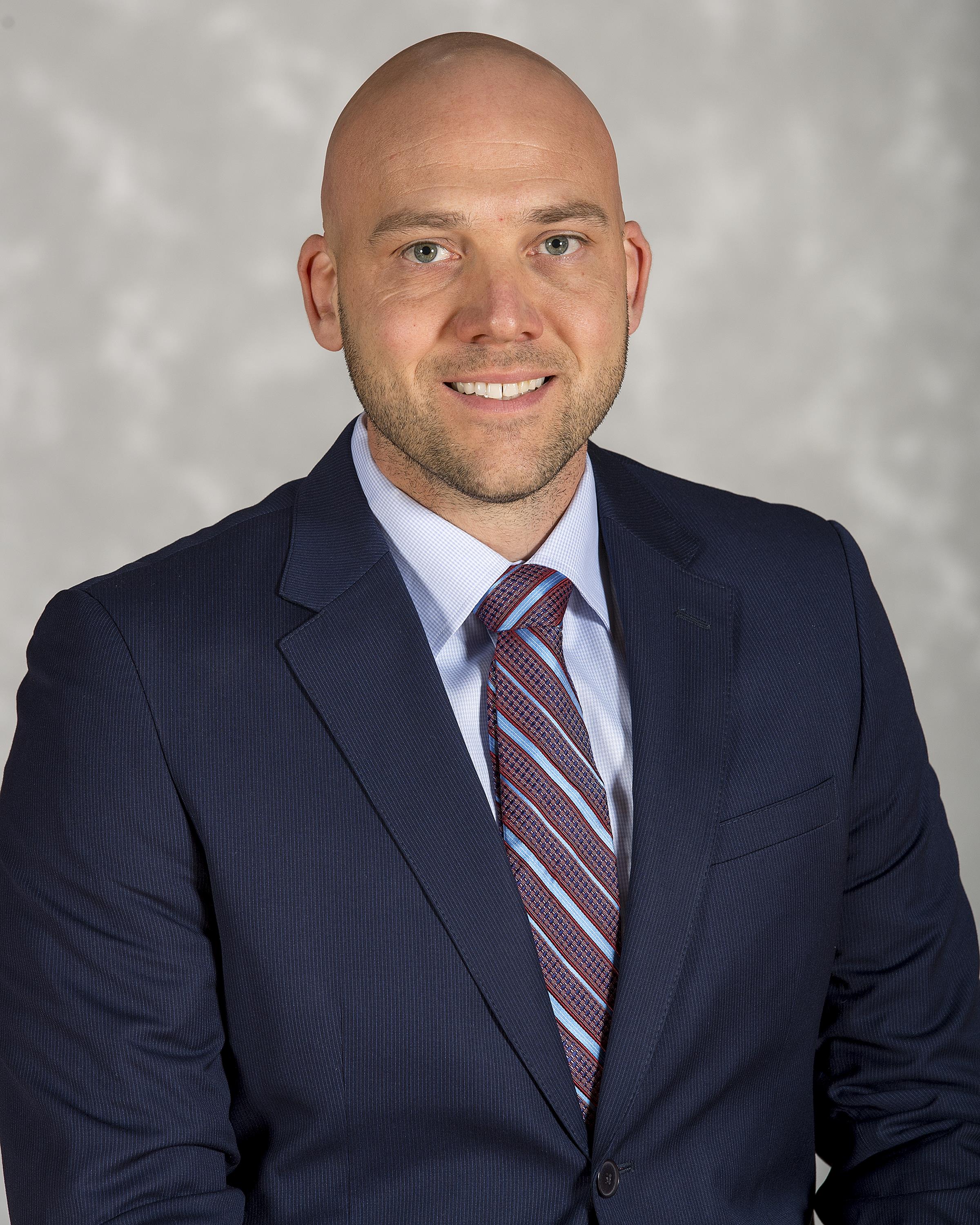 Head shot image of men's basketball assistant coachKevin Driscoll
