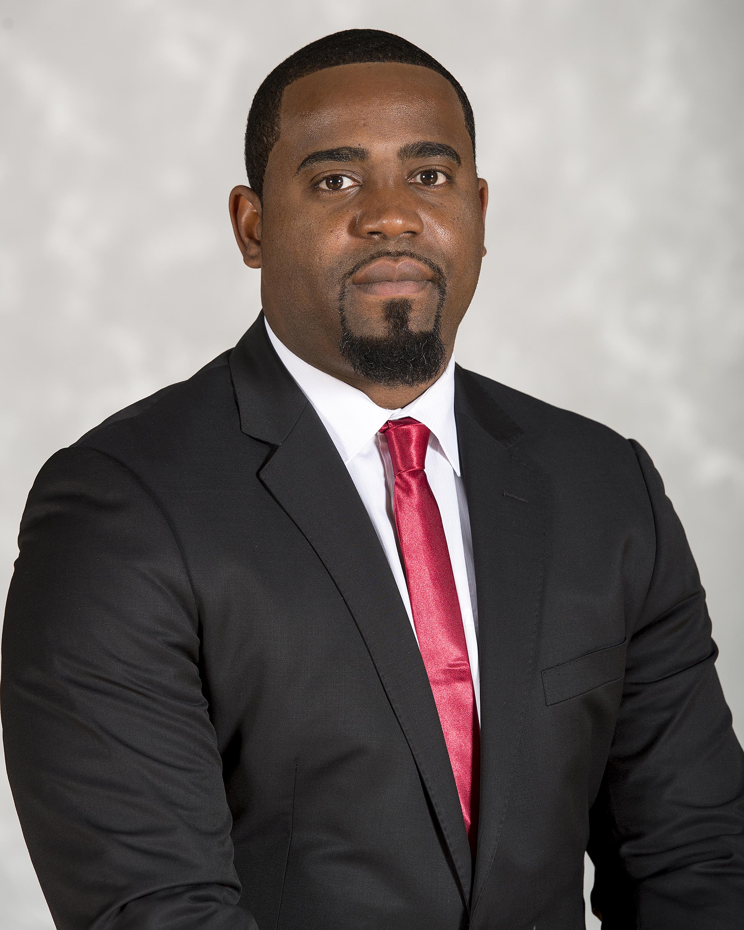 Head shot image of men's basketball assistant coach Serge Clement