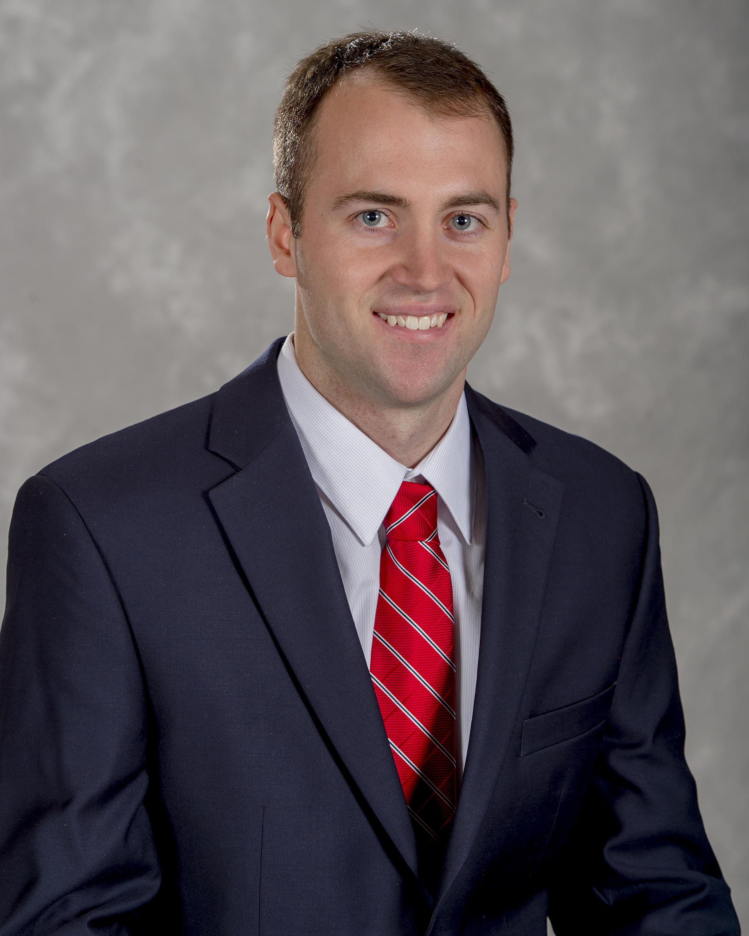 Head shot image of football director of operations Adam Schmitt