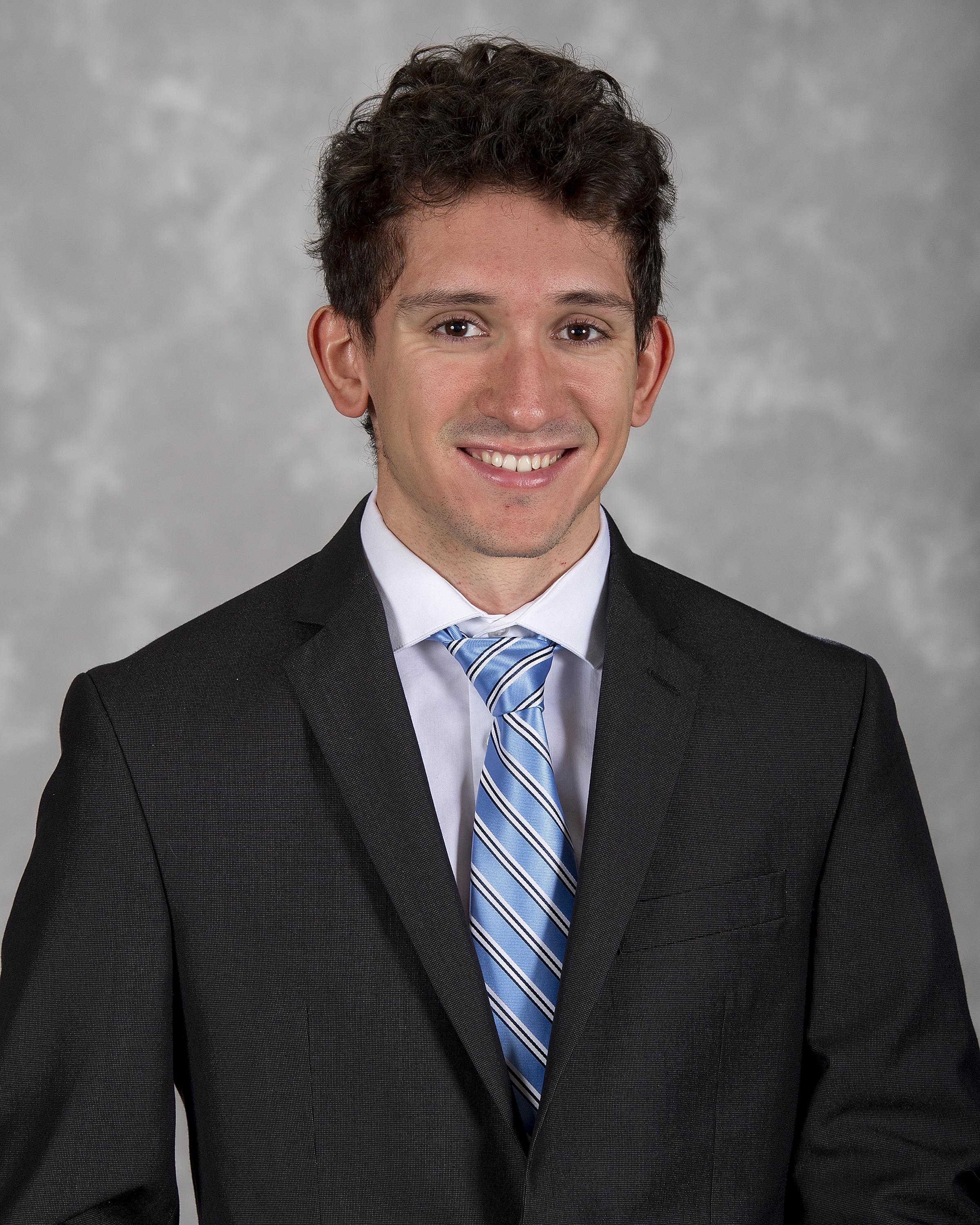 Head shot image of men's and women's cross country/track & field assistant coach Nick Cruz