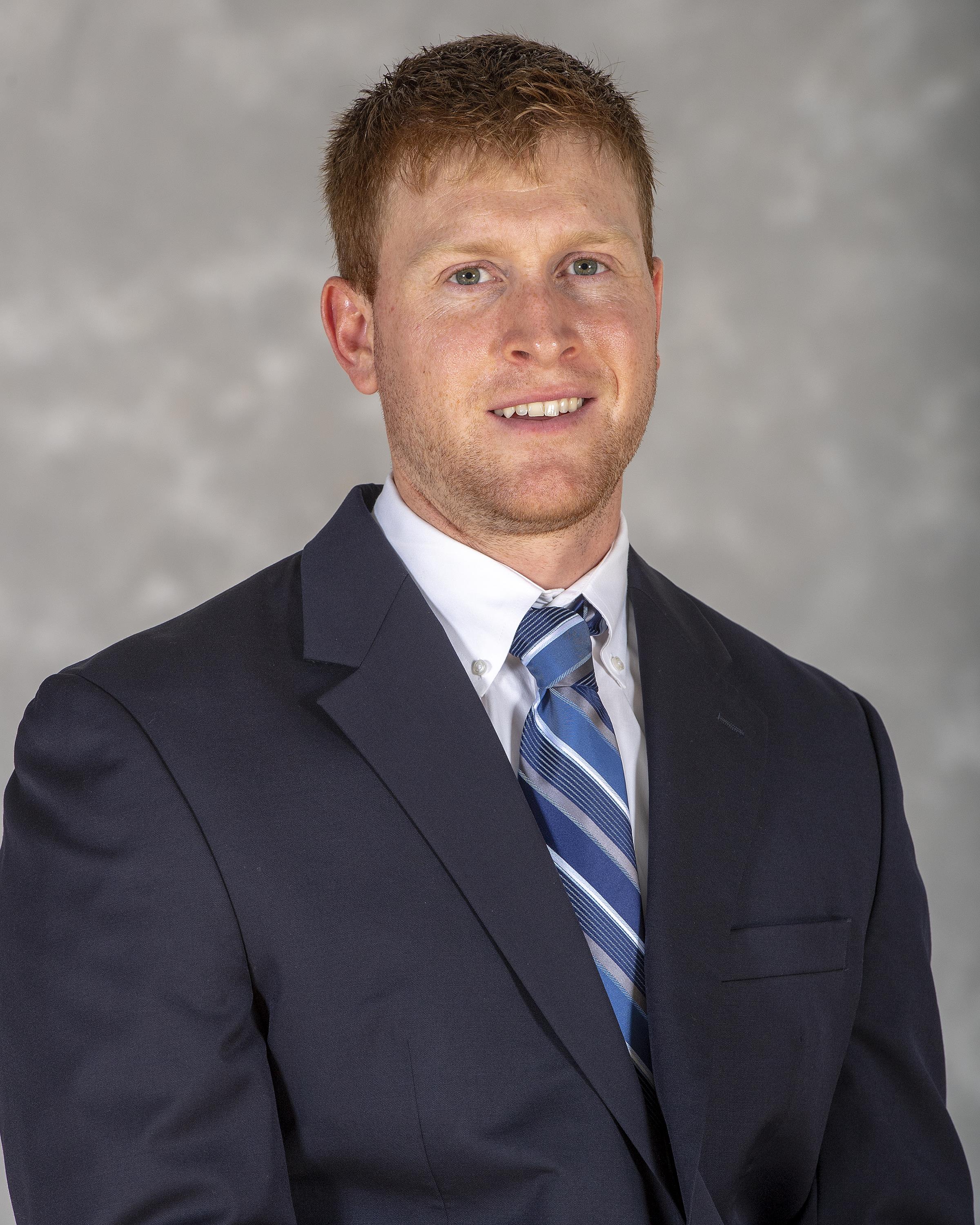 head shot of assistant football coach Casey Tosches