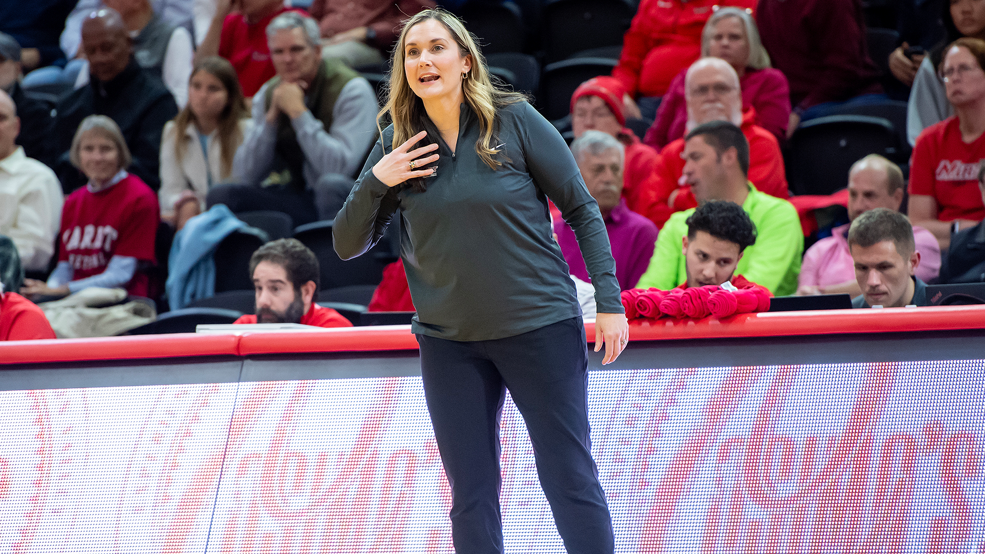 Erin Doughty coaching on sidelines