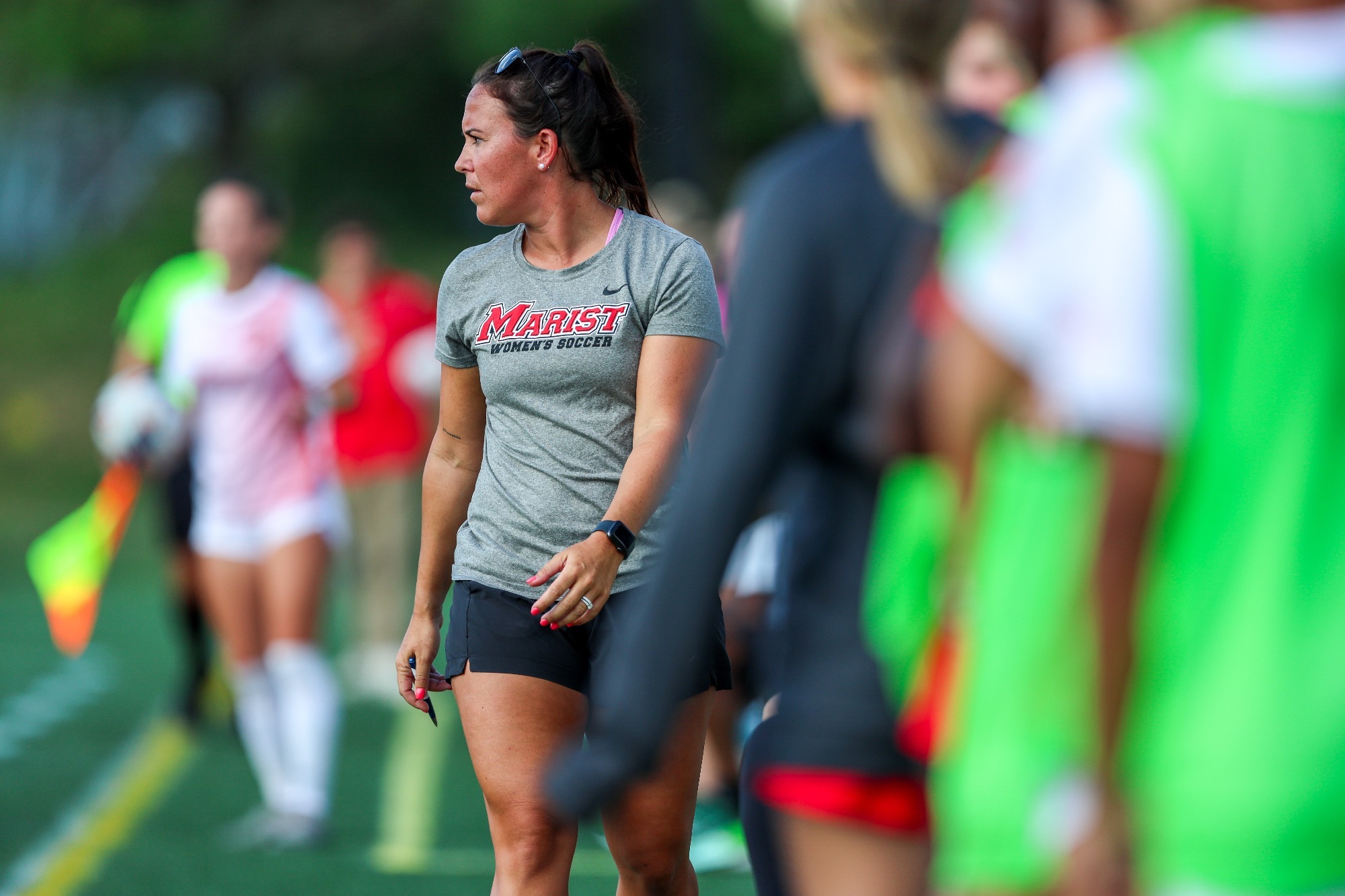 Coach Nicole Pacapelli on the sideline