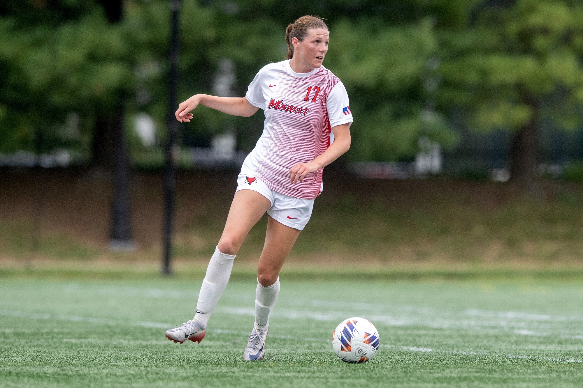 Sophia Dejoia running with ball