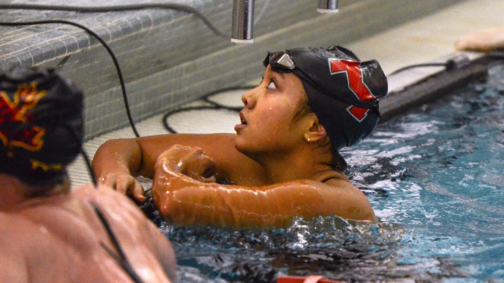 Isabelle Cabello looks up while in the pool
