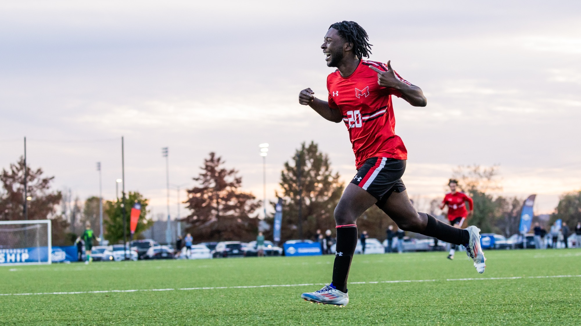 Axton Anom celebrates a goal at the GLVC Semifinals