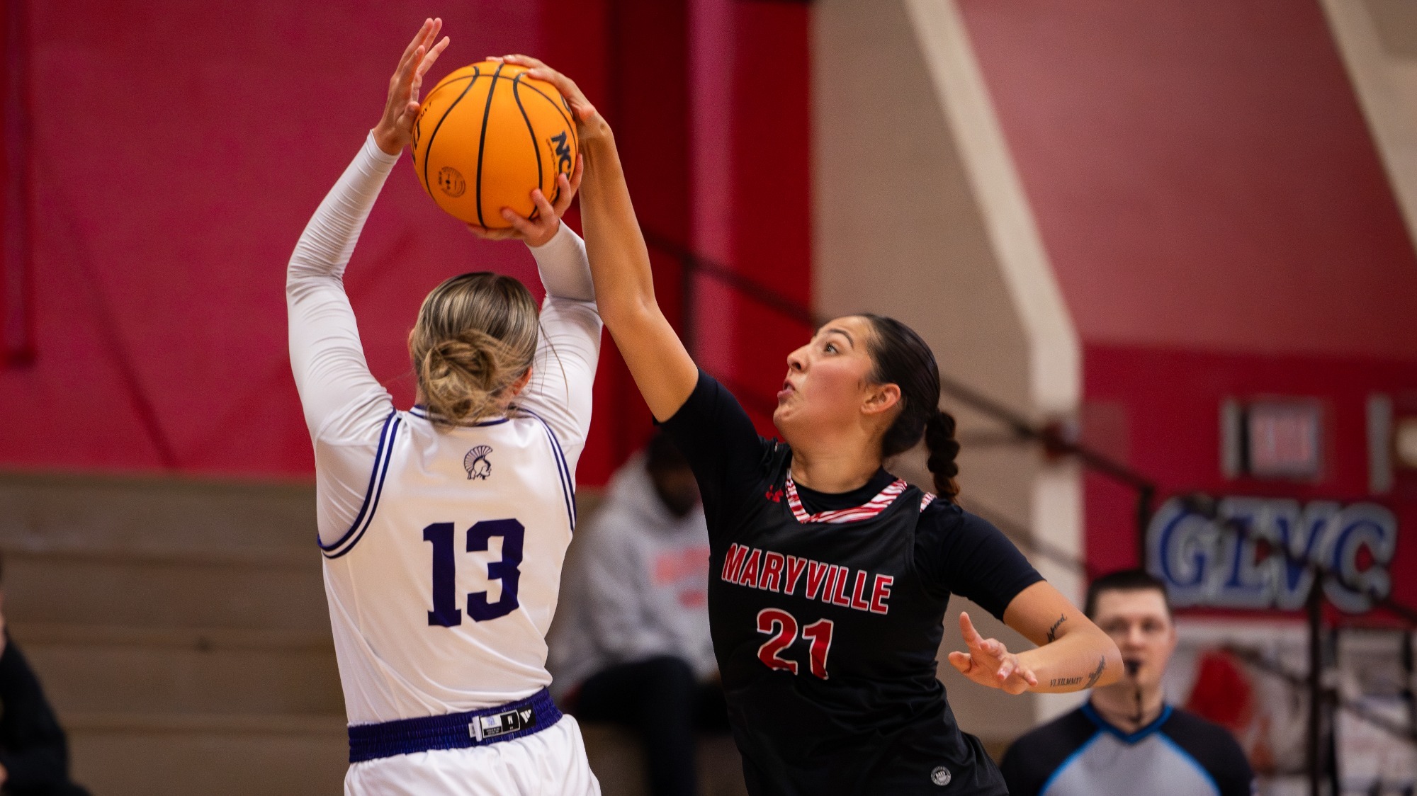 Alicia Burgos blocks a shot versus Winona