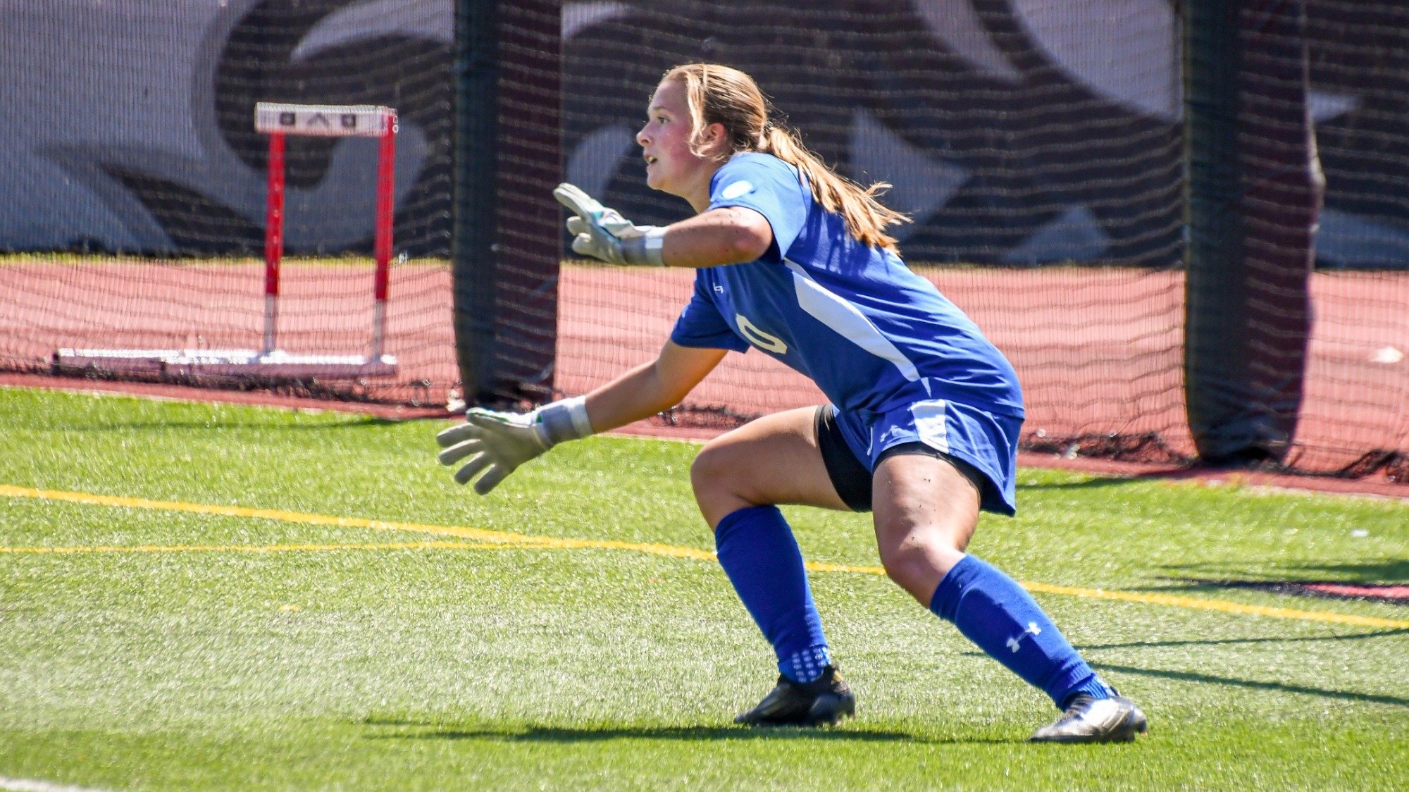 Sophia Sulawske dives to save the ball