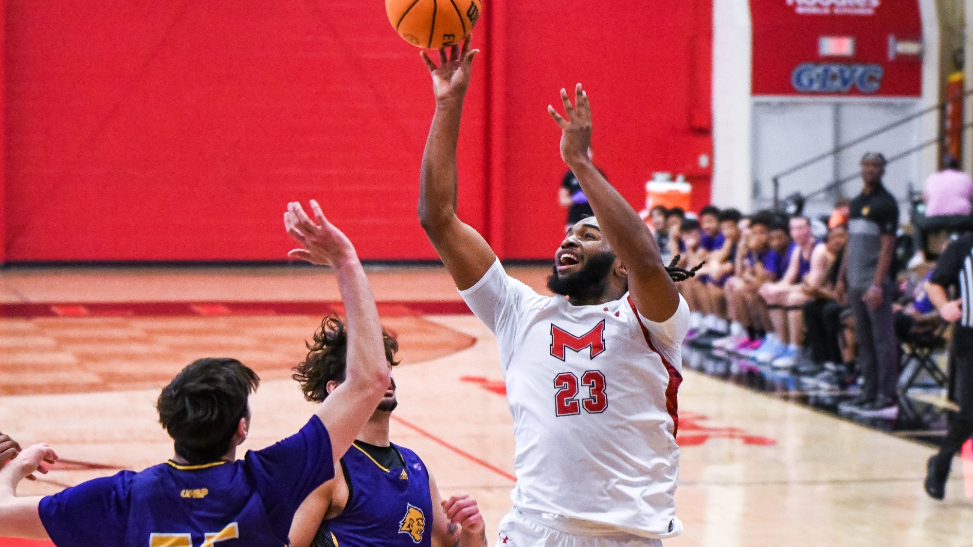 Kobe Clark drives under the basket