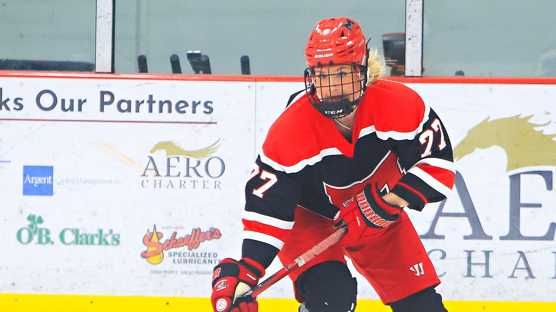 Haley Beckett moves the puck