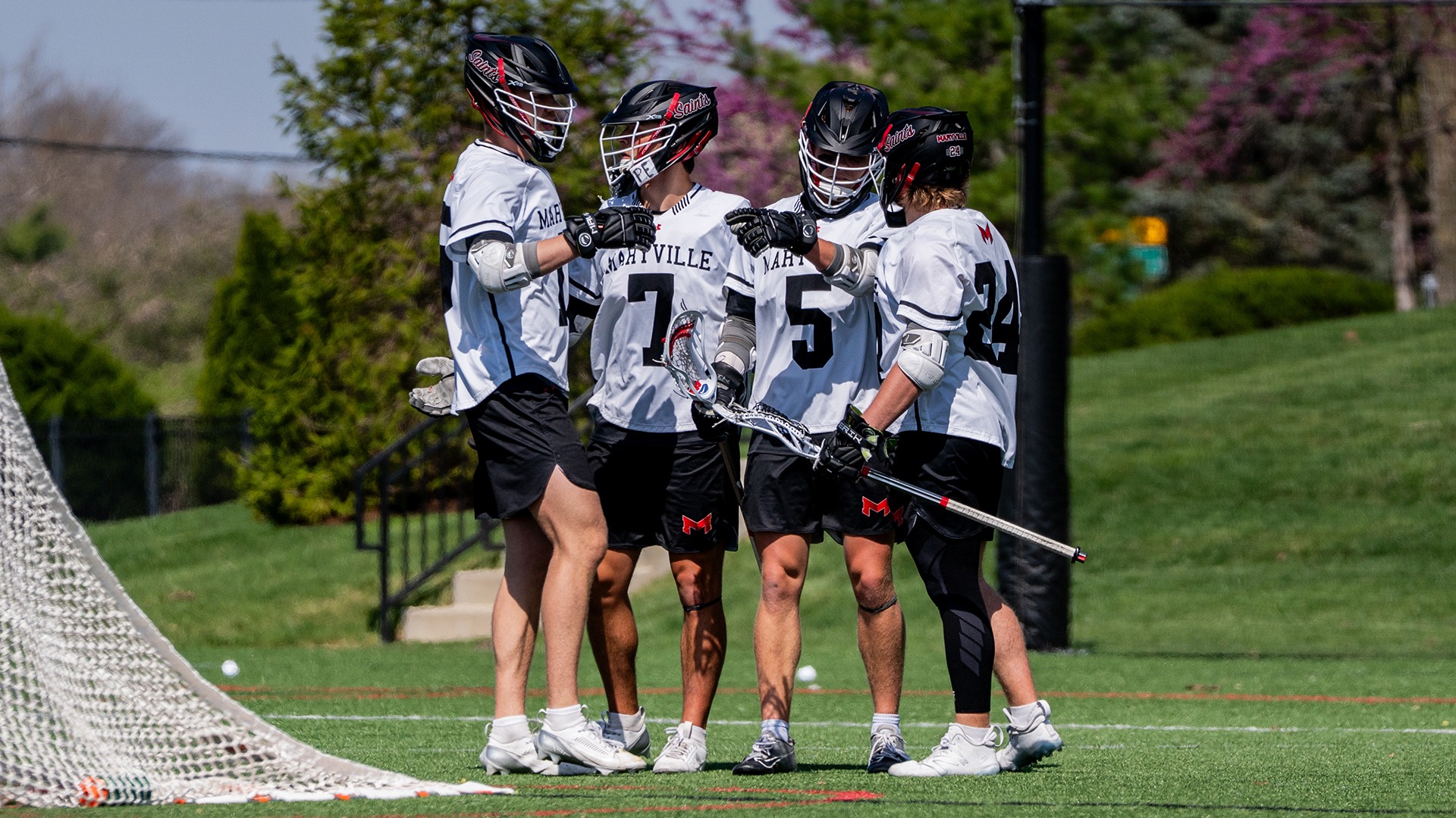 MLAX team celebration vs Quincy