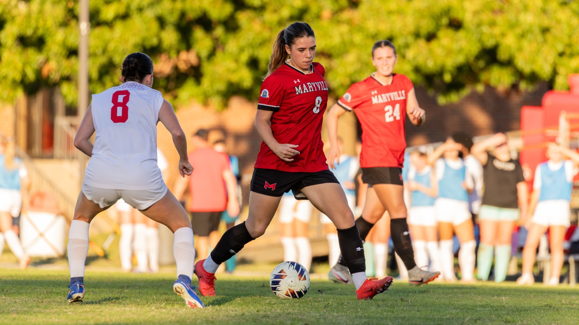 Isabella Lobley moves the ball