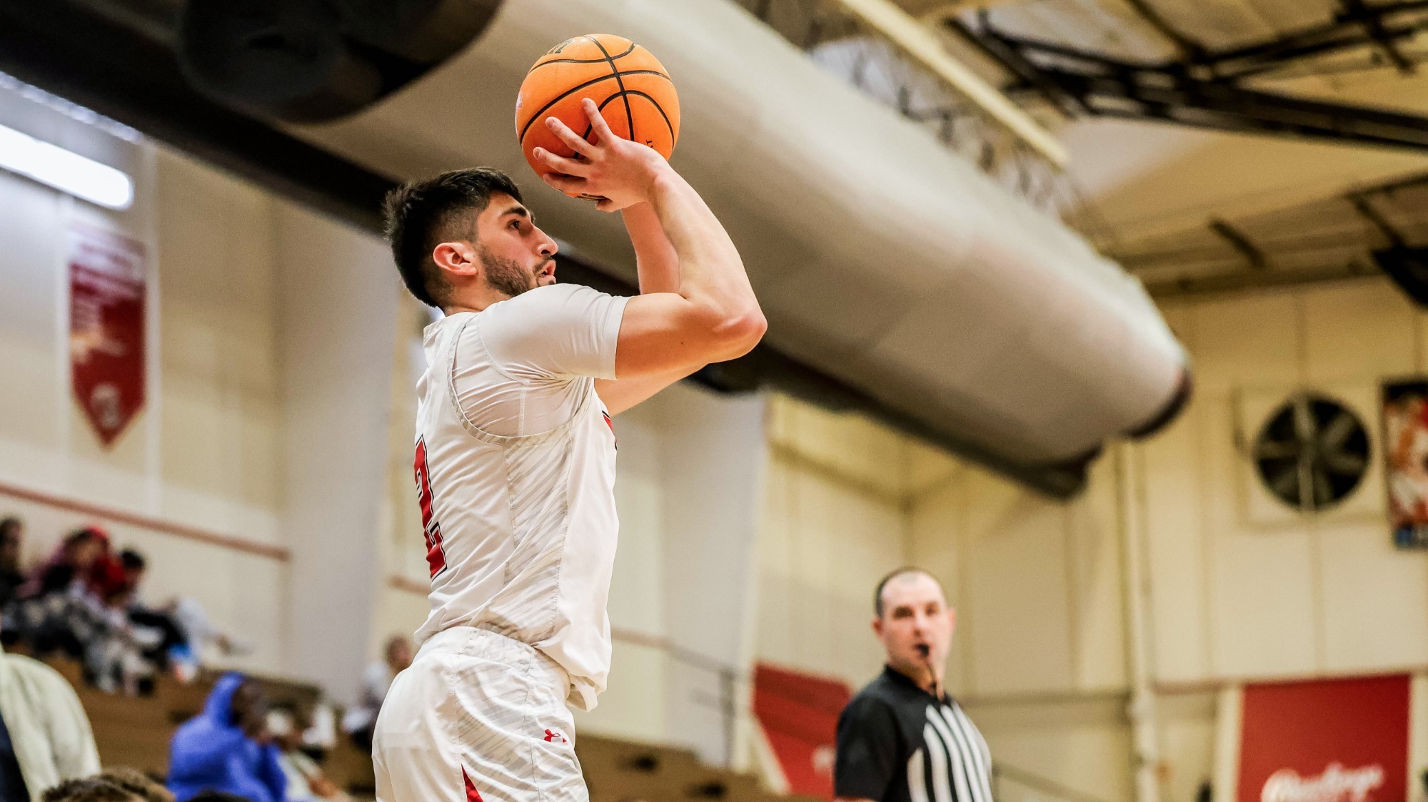 Evan Palmquist shoots a three