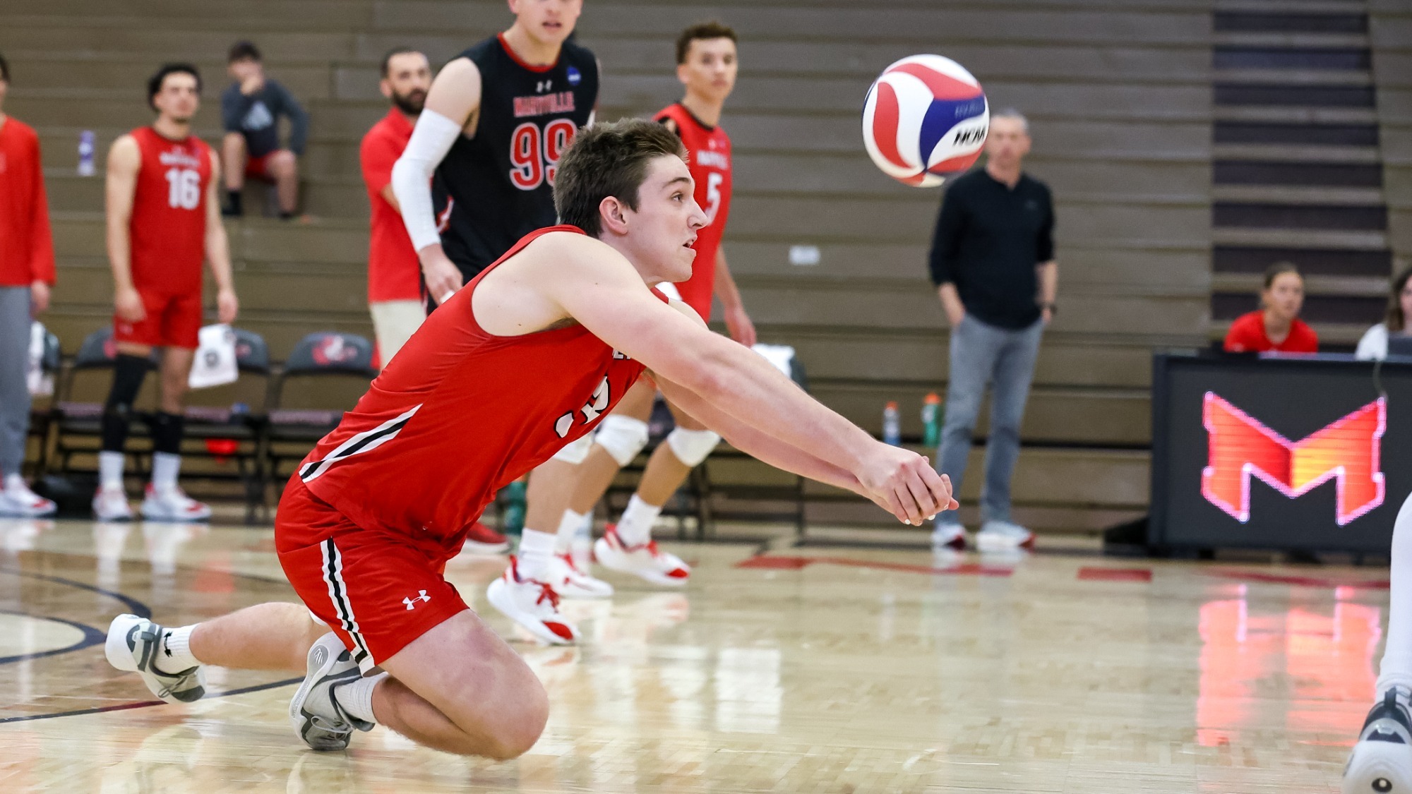 Aidan Whitemountain digs a ball