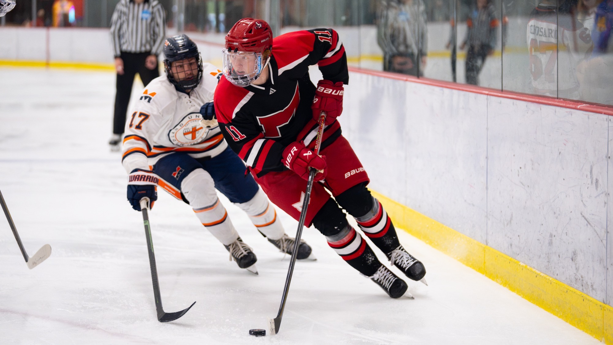 Adam Timm moves the puck