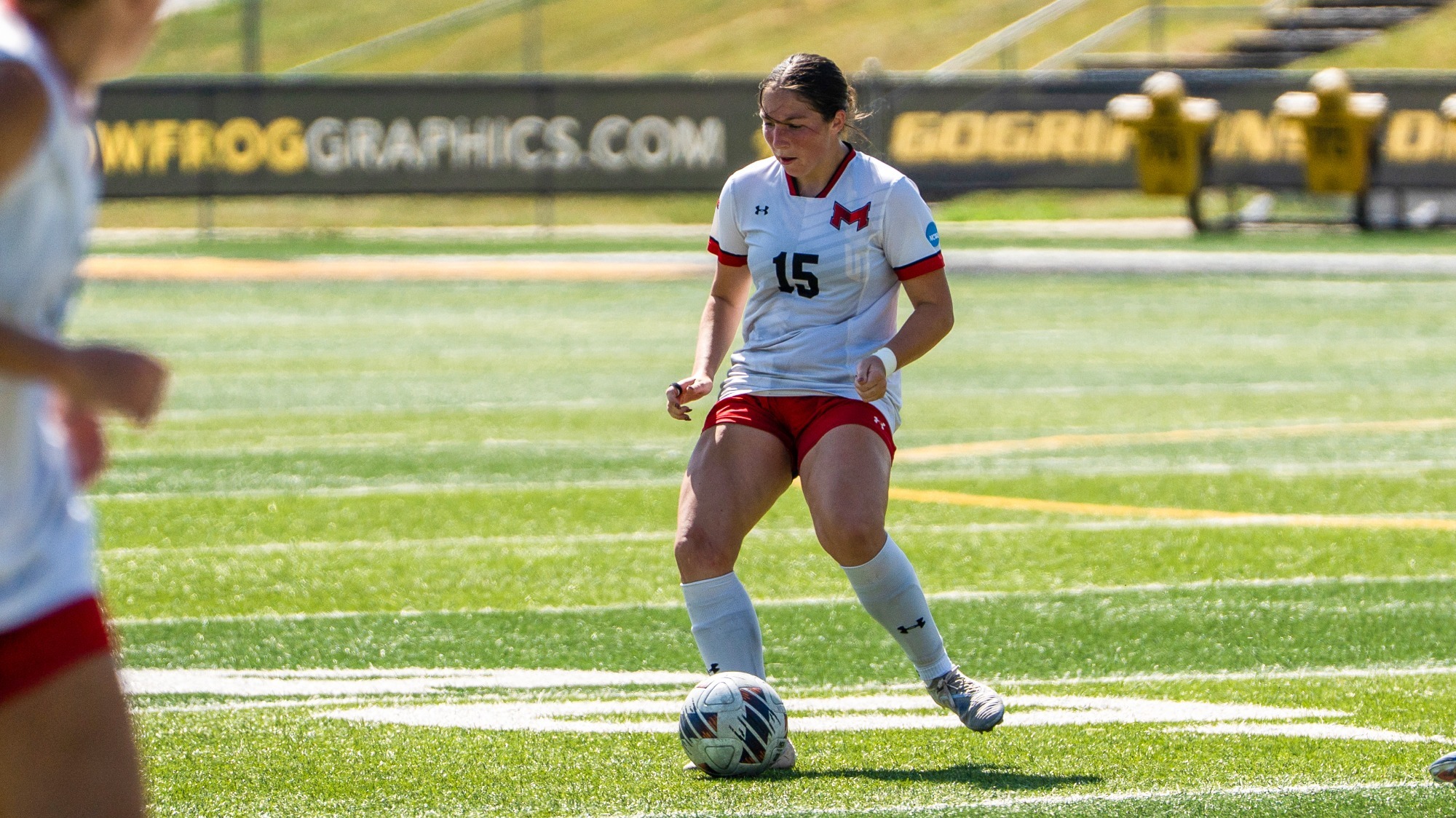 Allison Estanich moves the ball in the midfield